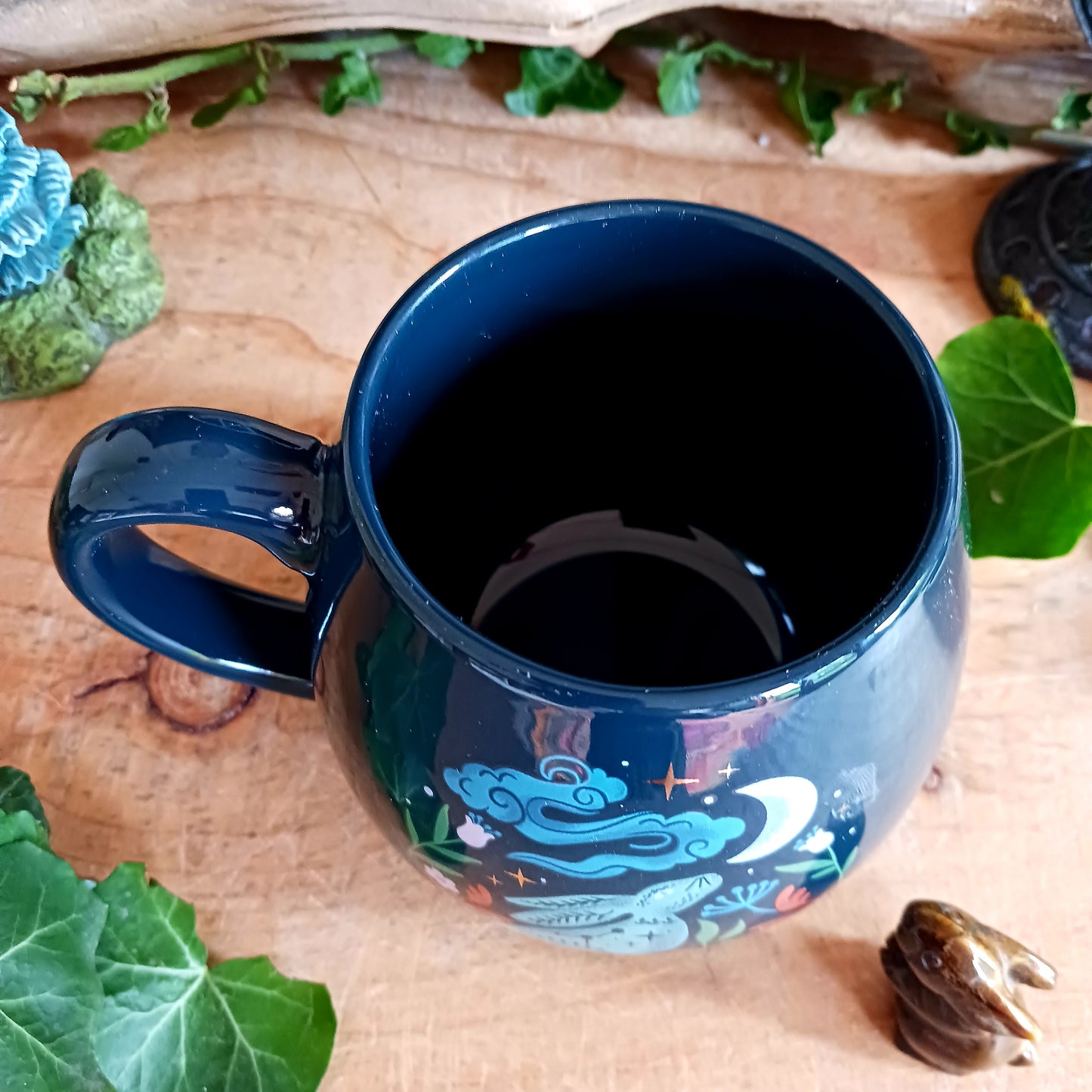 This mystical midnight hare ceramic mug makes a charming addition to a mug collection. Featuring a captivating design of a moon gazing hare underneath a starry night sky, this rounded mug will make every morning start with a touch of magic and wonder.