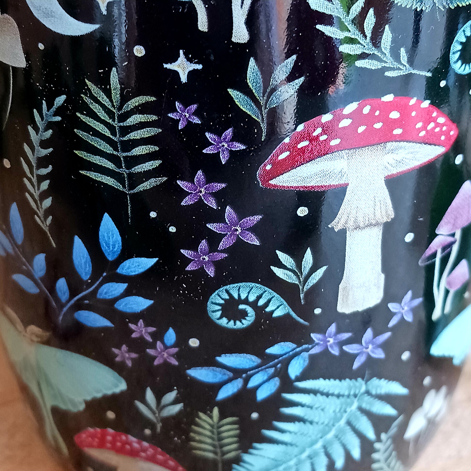 This black ceramic mug features a fabulous mystical forest print with magical mushrooms, toadstools and other forest flora & fauna. It's sure to start your morning off with a touch of magic and wonder!