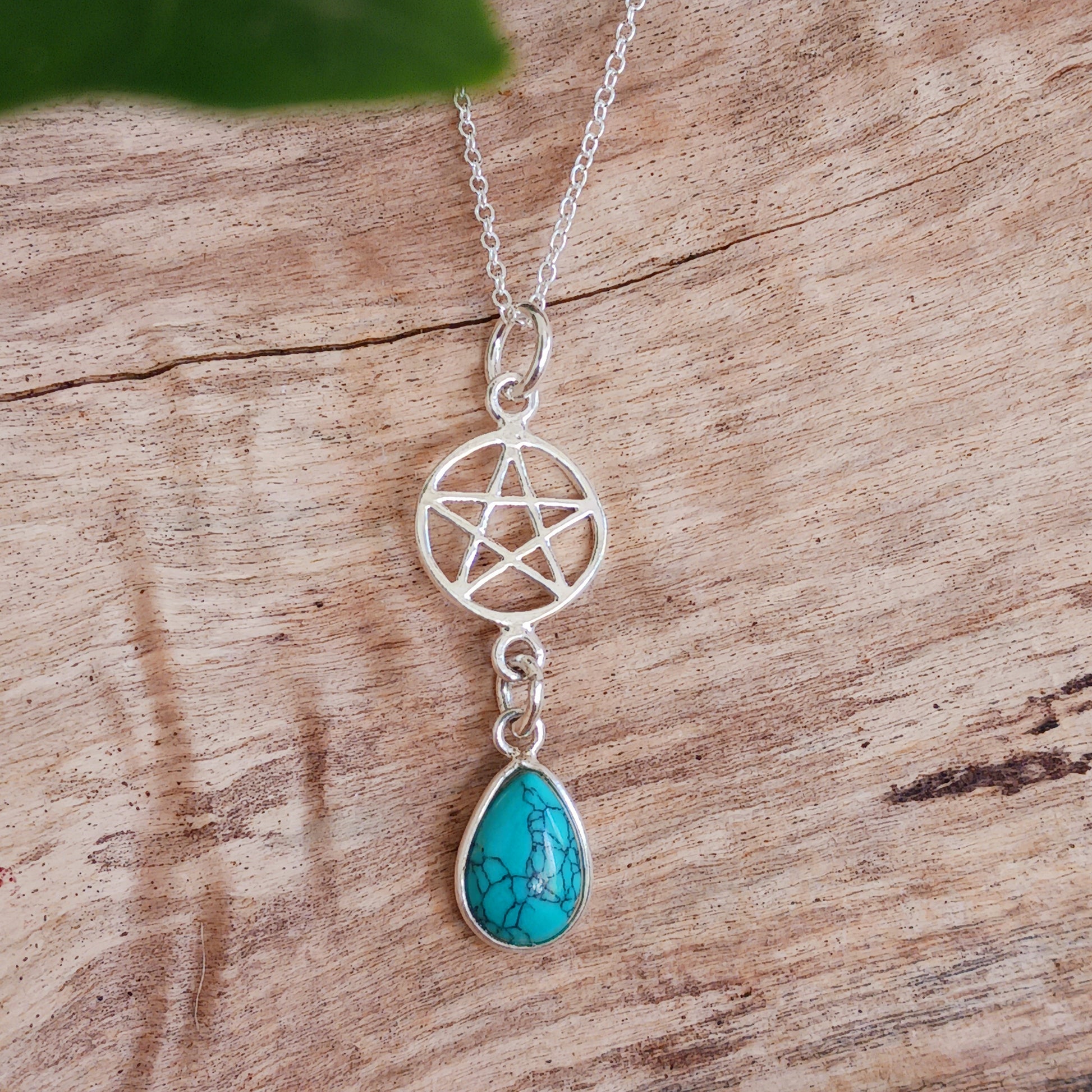 This handcrafted sterling silver Pentagram pendant has a beautiful Turquoise teardrop gemstone and is presented on a 925 sterling silver chain.