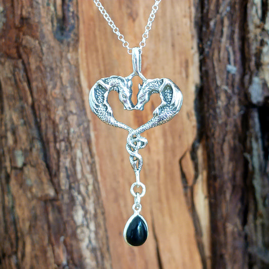 This beautifully detailed 925 Sterling Silver Dragon Heart Pendant is set with a Black Onyx Teardrop Gemstone. The two dragons are set in a loving, heart-shaped embrace and they become as one perfect being.