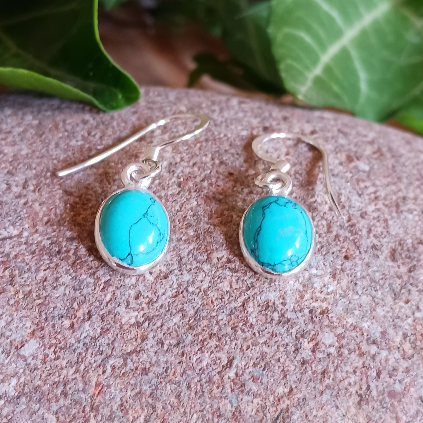 These pretty Turquoise oval earrings are a perfect addition to any outfit.