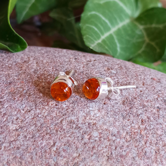 Handcrafted with beautiful large Amber gemstones, the stones are set within simple sterling silver frames, adding a modern and elegant touch to the natural centrepiece. Each Amber gemstone boasts a classic cut, with dome top and perfect polish.