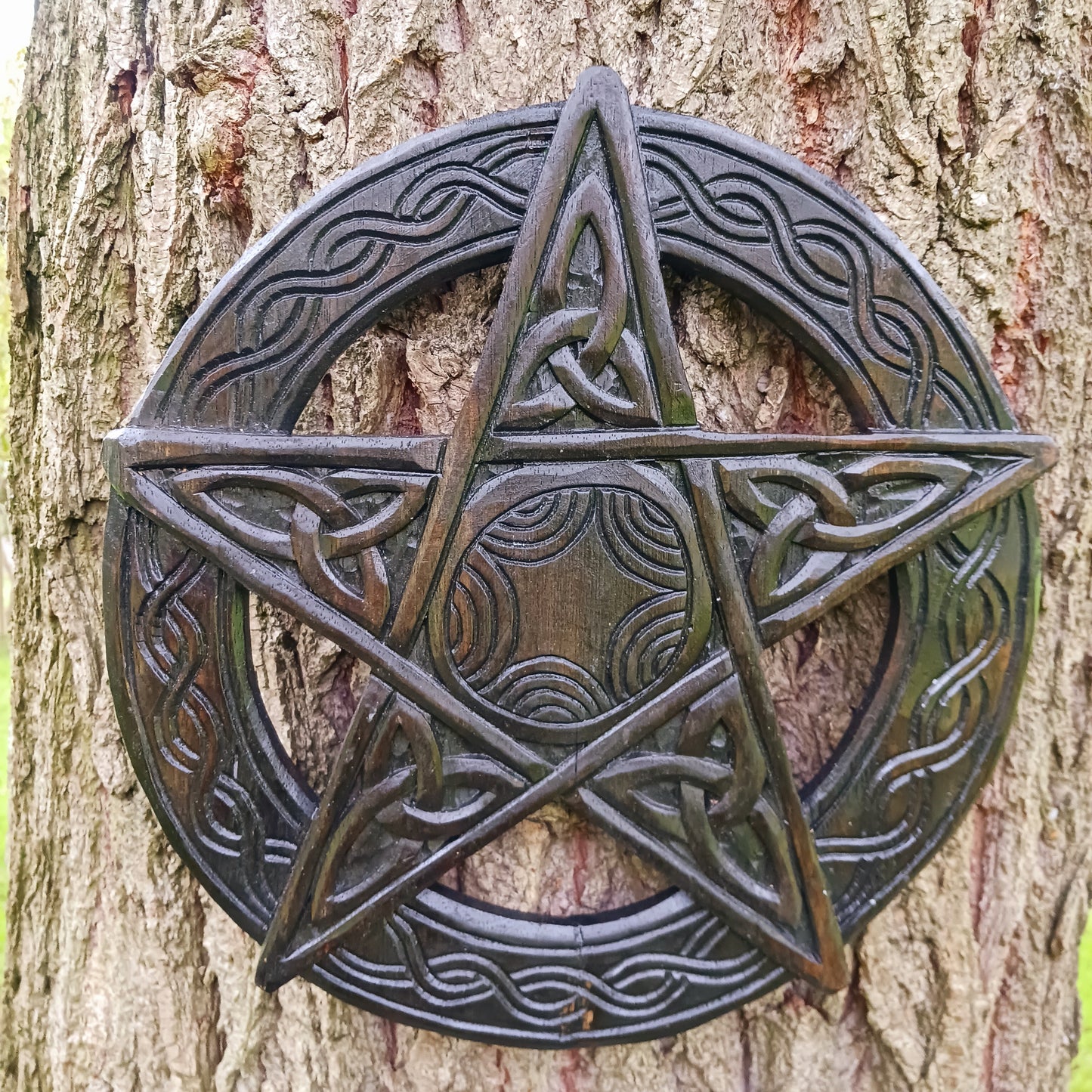 This beautiful wooden pentacle has been handcrafted and decorated with five Triquetra or endless knots which hold a great deal of symbolic meaning including a Christian representation of The Holy Trinity.