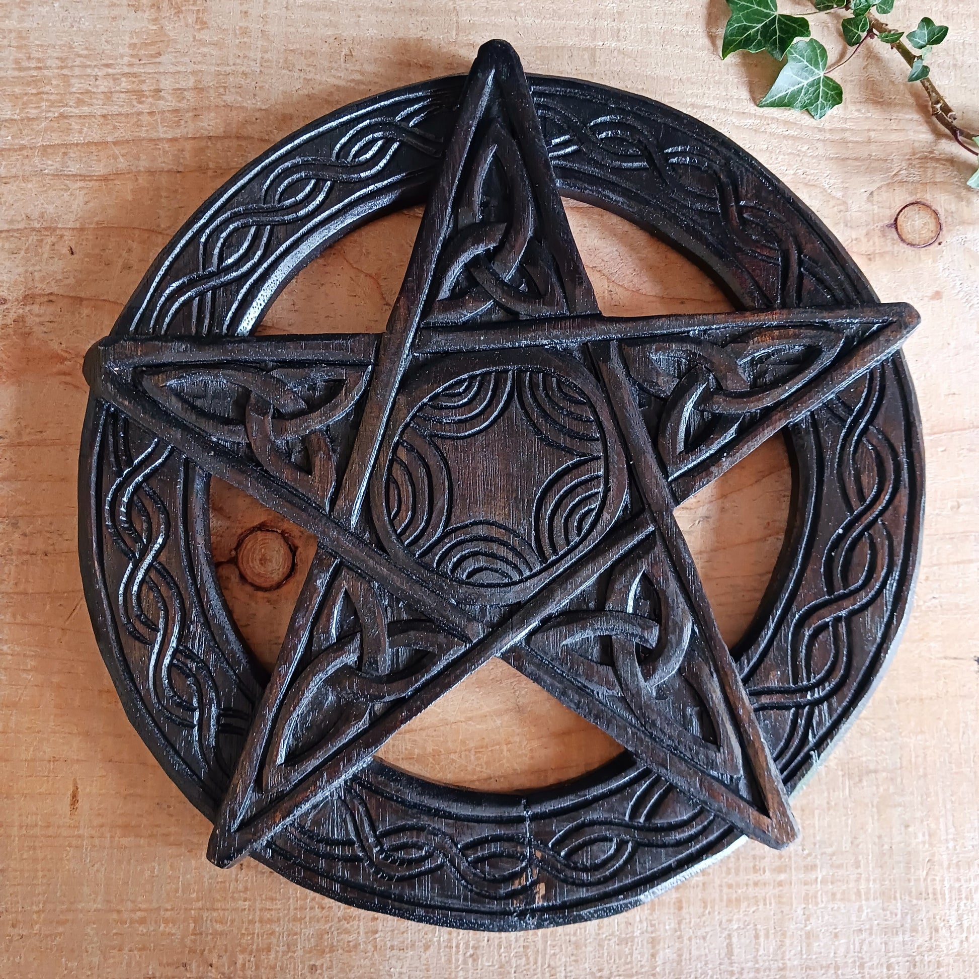 This beautiful wooden pentacle has been handcrafted and decorated with five Triquetra or endless knots which hold a great deal of symbolic meaning including a Christian representation of The Holy Trinity.