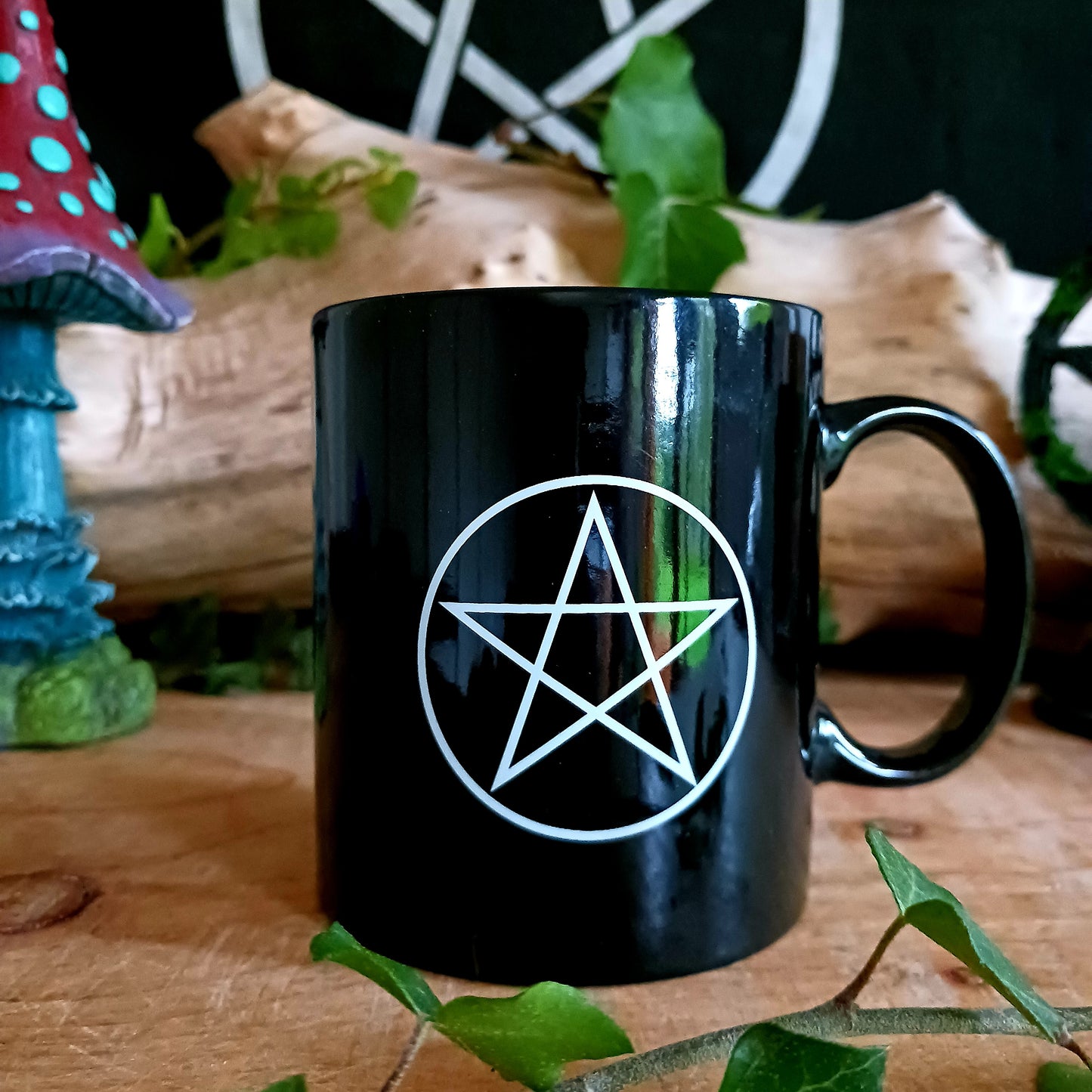 This simple black ceramic mug features a beautiful and intricate design of the Wiccan Pentagram five-pointed star. Perfect for any Wiccan devotee.