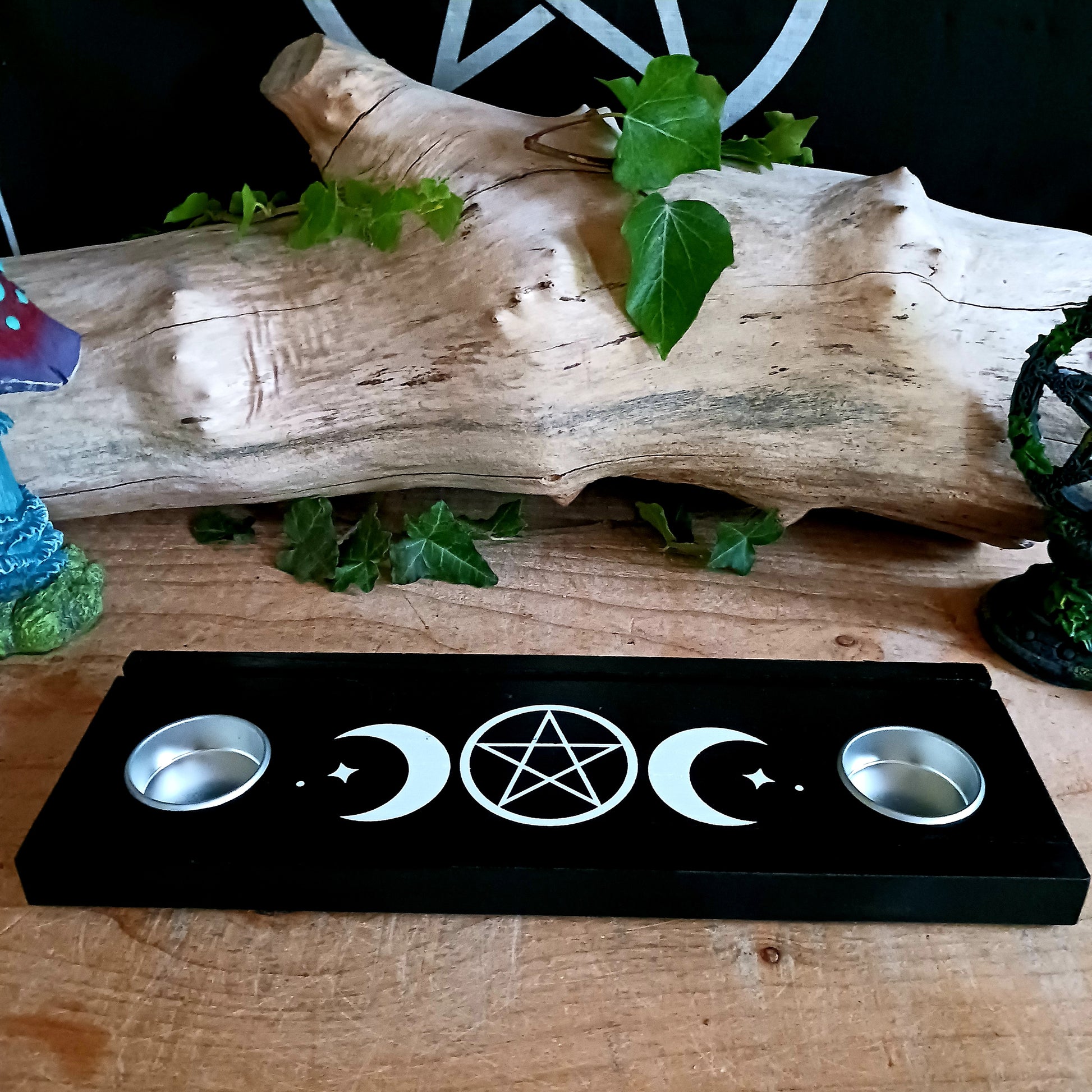 You can display your tarot card readings with this black wooden triple moon tarot card stand, that comes complete with two spaces for holding tealight candles to create ambiance, and allow the meaning of the cards to resonate.