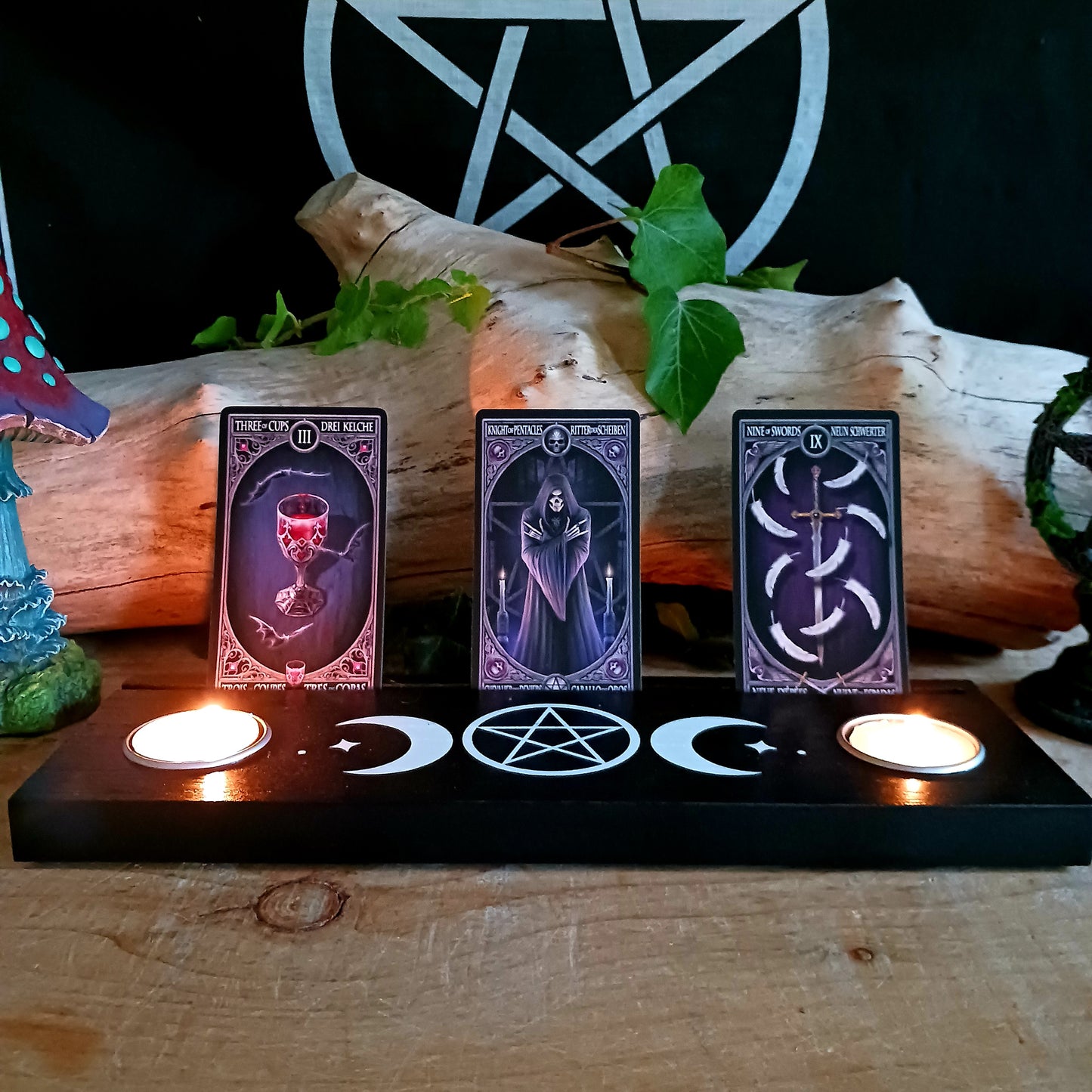 You can display your tarot card readings with this black wooden triple moon tarot card stand, that comes complete with two spaces for holding tealight candles to create ambiance, and allow the meaning of the cards to resonate.