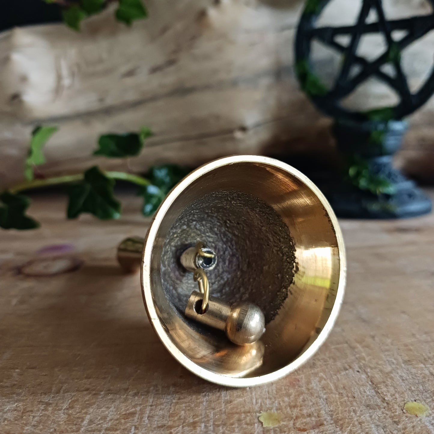 This lovely little bell is made of brass and has an etched pentacle on each side. The bell produces a light, crips ring. This bell can be used to mark the beginning and ending of a meditation session, or it can be used as handbell.