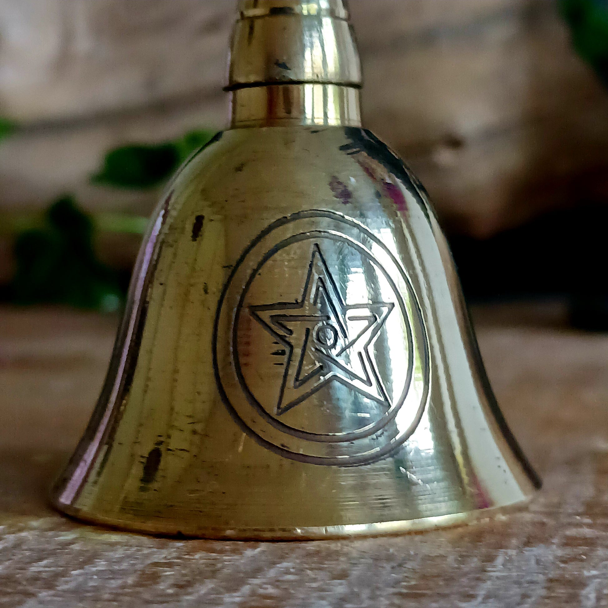 This lovely little bell is made of brass and has an etched pentacle on each side. The bell produces a light, crips ring. This bell can be used to mark the beginning and ending of a meditation session, or it can be used as handbell.