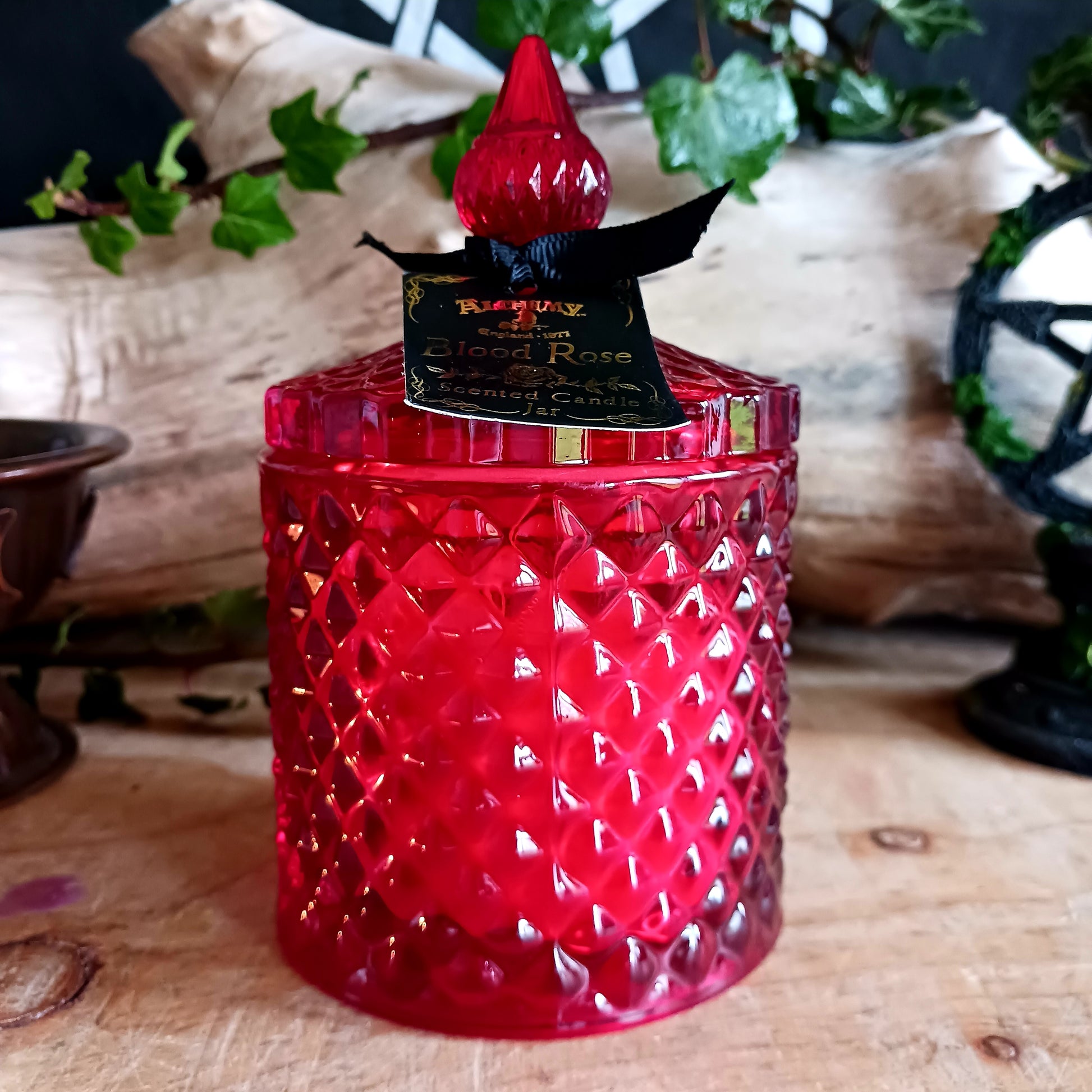 This blood rose red, vintage inspired, lidded candle jar encapsulates a sensual scented candle. Light the candle and the dark sensual aroma of the 'Blood Rose' will envelop your boudoir! Once the candle has burnt, this stunning, cut glass effect jar can then be used to keep safe your trinkets and treasures.