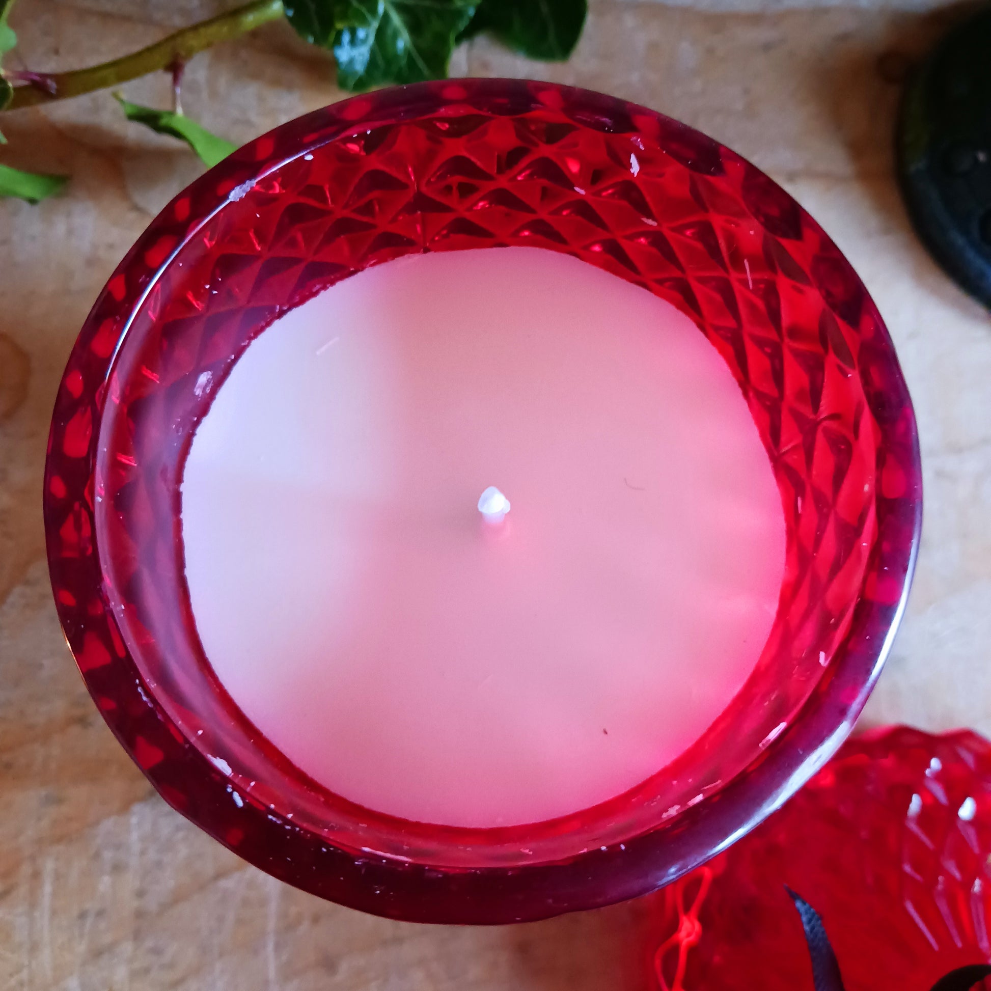 This blood rose red, vintage inspired, lidded candle jar encapsulates a sensual scented candle. Light the candle and the dark sensual aroma of the 'Blood Rose' will envelop your boudoir! Once the candle has burnt, this stunning, cut glass effect jar can then be used to keep safe your trinkets and treasures.