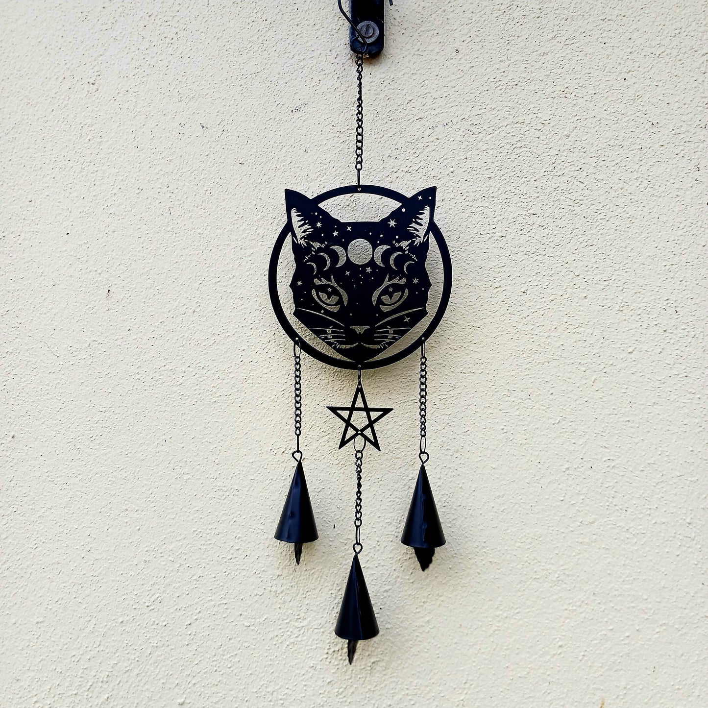 From the Alchemy England hanging decoration collection, this magic black cat face with moon phase and stars has three magical chimes!