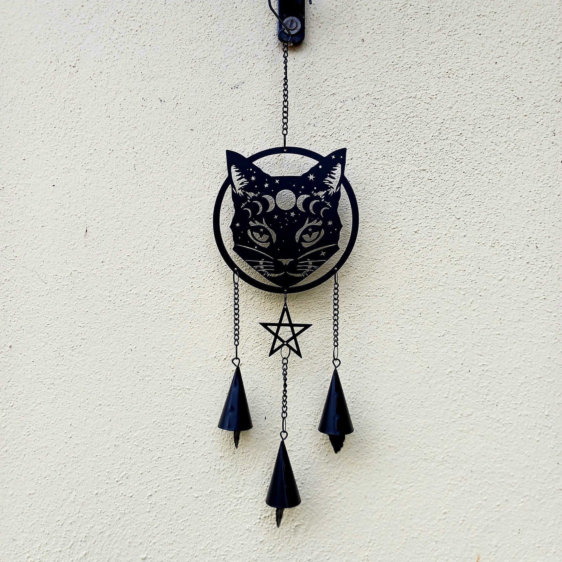 From the Alchemy England hanging decoration collection, this magic black cat face with moon phase and stars has three magical chimes!