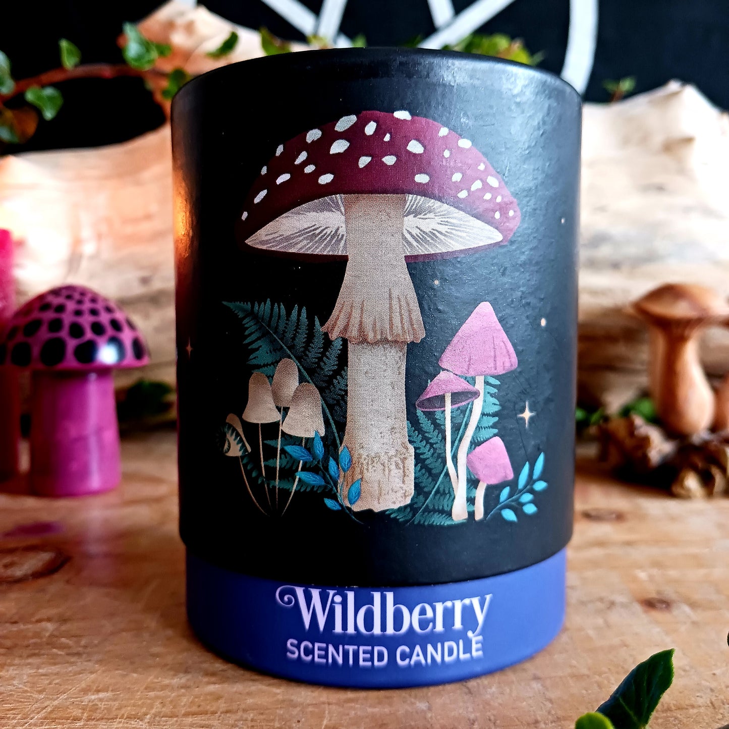 A Wildberry fragranced candle smells divine and is decorated with a mystical mushroom design, perfect for creating a magickal ambience.