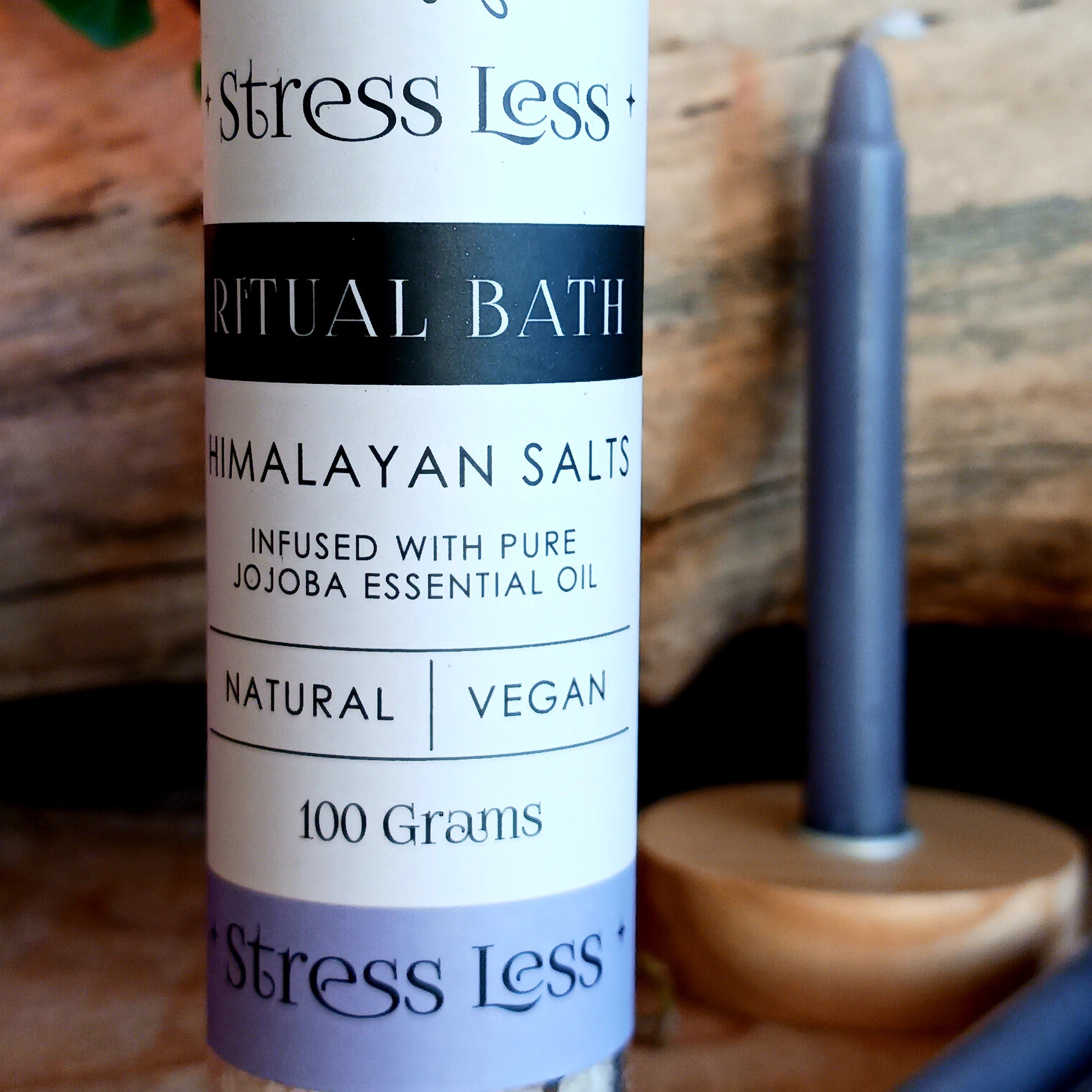 Alleviate stress and promote relaxation with the Stress Less Ritual Bath Kit. The kit features 100g of ritual bath salts, pack of 4 purple spell candles and a candle holder.