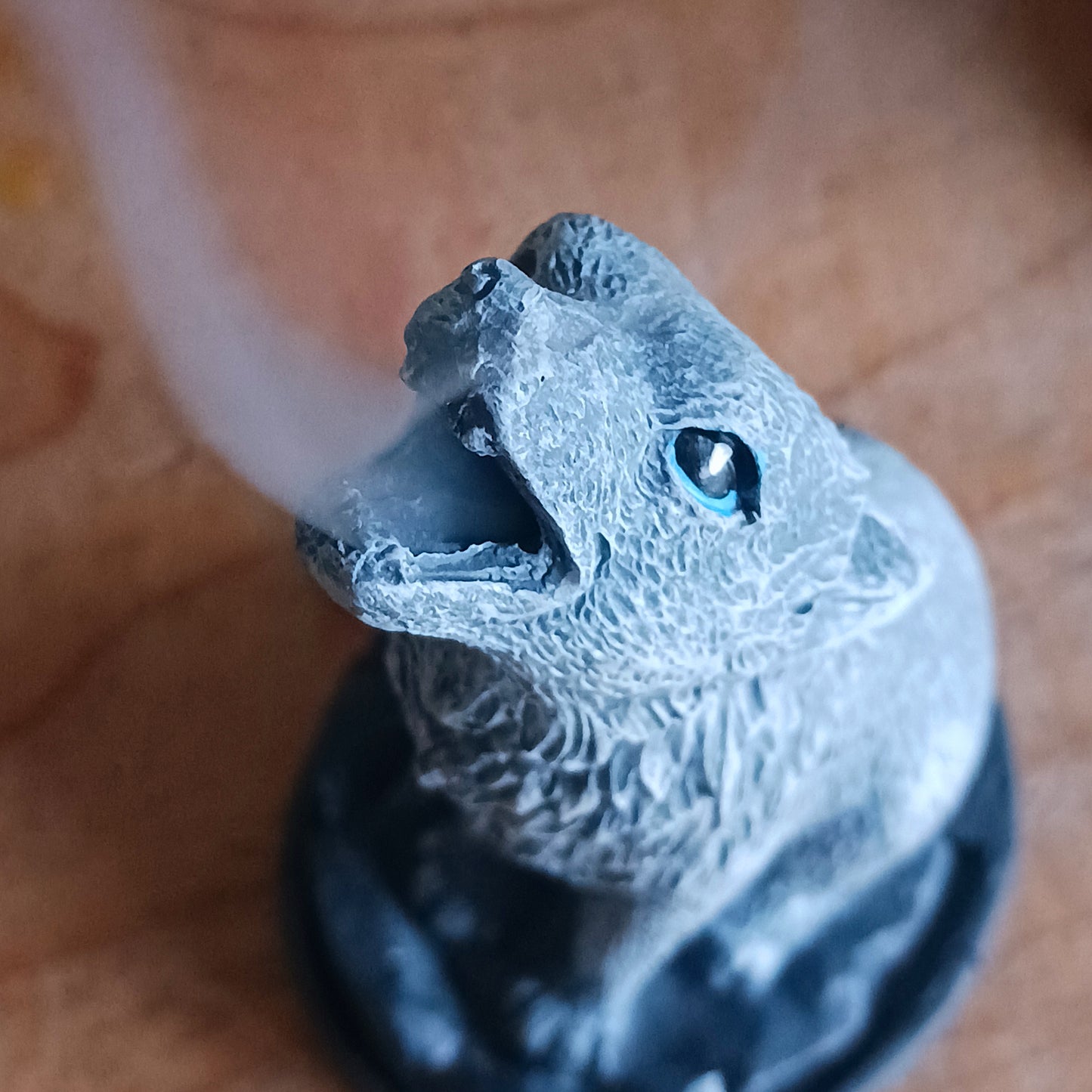 This detailed howling wolf incense cone burner has been designed by Lisa Parker. When the incense cone is burning, smoke rises from the mouth of the howling wolf.