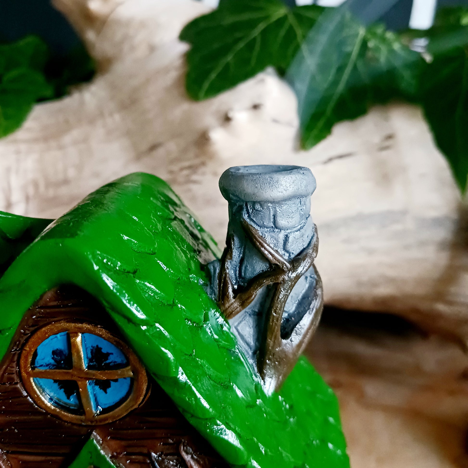 This adorable and detailed incense cone burner is shaped like a little fairy house called Woody Lodge.  Designed by Lisa Parker, you place an incense cone inside the Woody Lodge and watch as smoke rises from the chimney. The house comes in a little gift box making it the perfect gift for fairy and incense lovers!