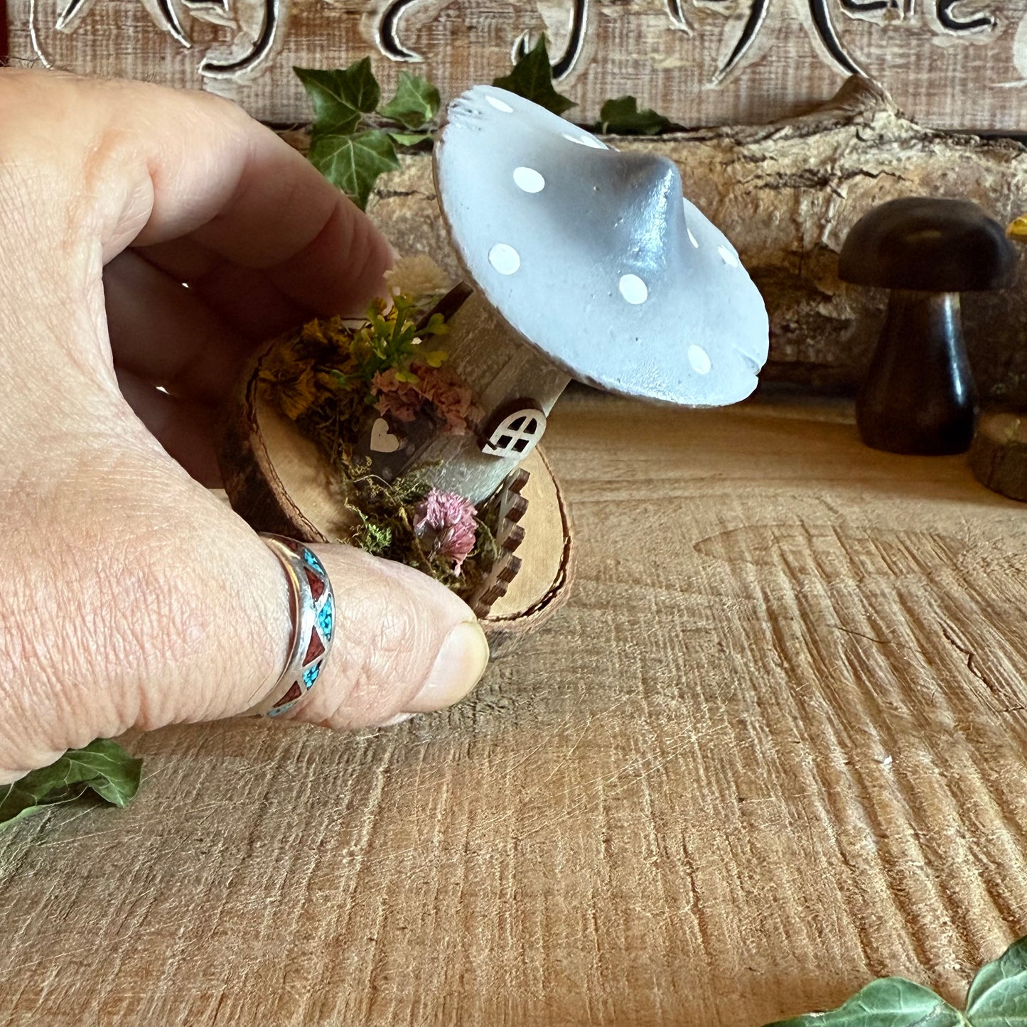 Step into a storybook world with our Spring Folk Art Mushroom Cottage, a charming miniature home inspired by blooming meadows and enchanted forests. Each cottage is hand painted with loving detail, featuring bright spring tones and floral folk art patterns that celebrate renewal and the magic of nature’s awakening.