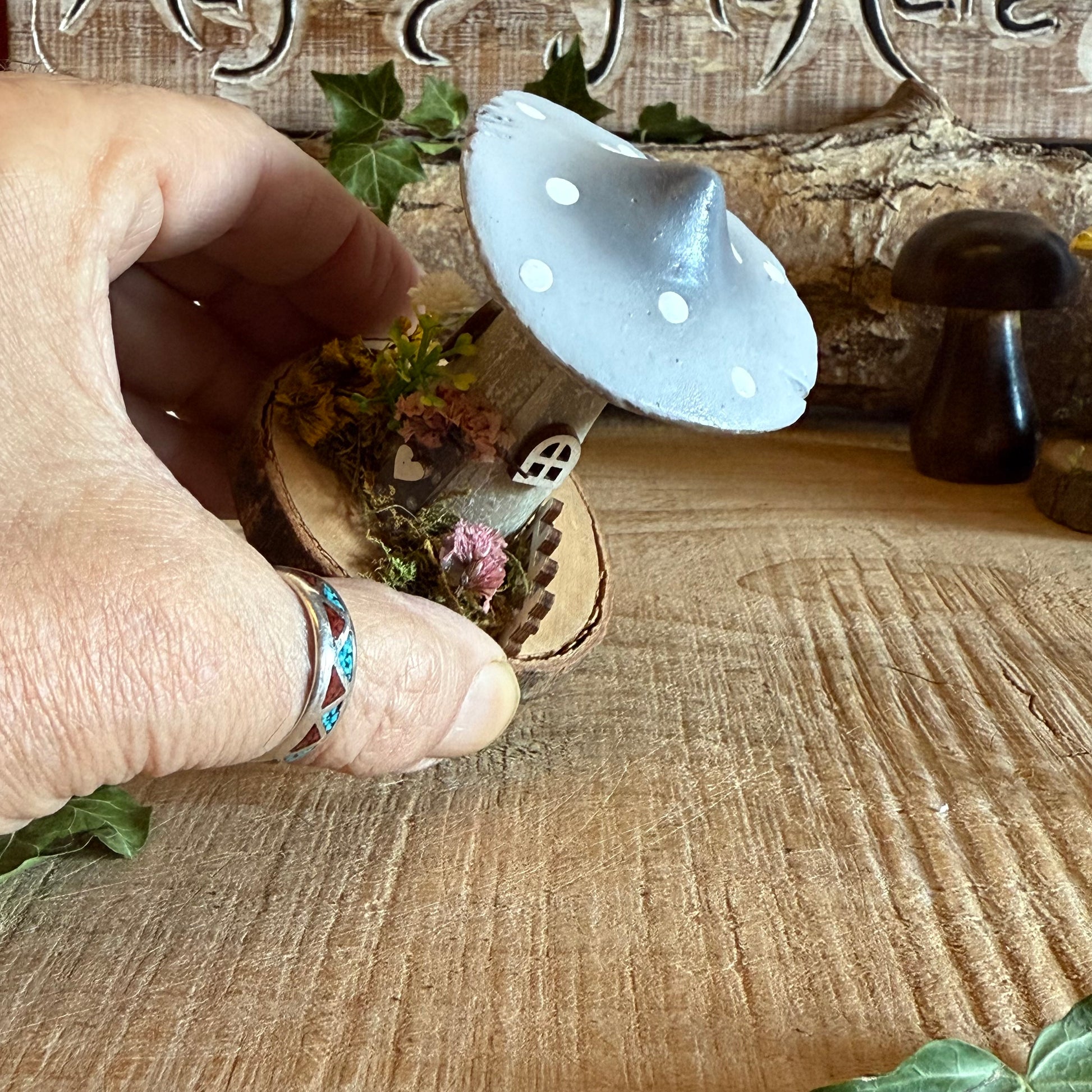 Step into a storybook world with our Spring Folk Art Mushroom Cottage, a charming miniature home inspired by blooming meadows and enchanted forests. Each cottage is hand painted with loving detail, featuring bright spring tones and floral folk art patterns that celebrate renewal and the magic of nature’s awakening.