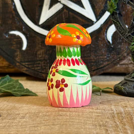 Step into the enchanted woodlands with our Hand Painted Wooden Mushroom Ornament, a charming treasure that feels as though it has grown straight from the mossy forest floor. Each mushroom is lovingly hand carved and painted by skilled artisans, creating a one-of-a-kind piece that celebrates the simple magic of nature.