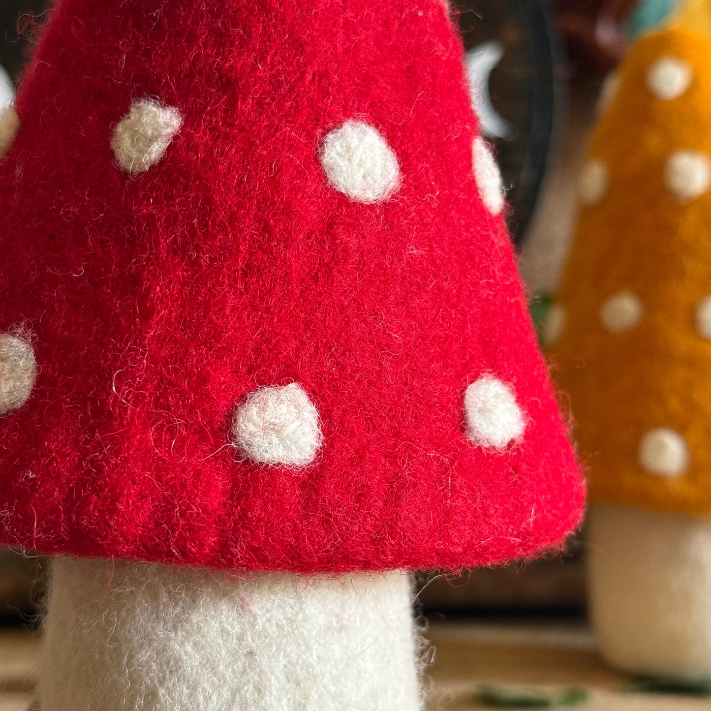Step into the enchanted world of Buddhamoon, where forest dreams and woodland whimsy come alive. Our Felt Large Standing Mushroom Decoration is a playful delight—perfect for bringing a touch of pixie charm to your home. Decorate your mantle, desk, dresser, or any dry nook that could use a dash of magic and colour.
