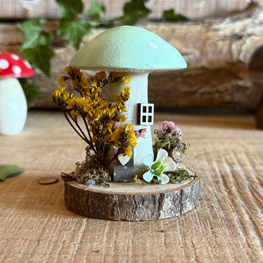Step into a storybook world with our Spring Folk Art Mushroom Cottage, a charming miniature home inspired by blooming meadows and enchanted forests. Each cottage is hand painted with loving detail, featuring bright spring tones and floral folk art patterns that celebrate renewal and the magic of nature’s awakening.