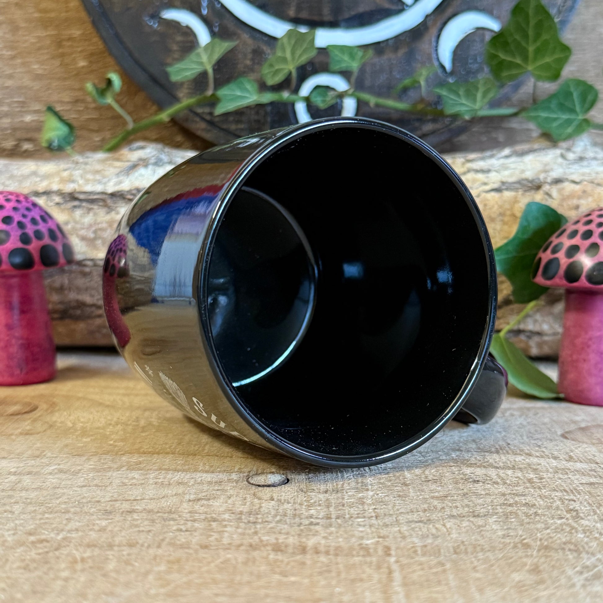 Show your support for all things magical with this black ceramic mug featuring crossed broomsticks and the phrase “Support Your Local Witch Coven.” Perfect for modern witches, mystical coffee lovers, and anyone who proudly backs their coven crew. With a 320ml capacity, it’s ideal for coffee, tea, or any magical potion. Microwave and dishwasher safe, this mug combines practicality with witchy style, making it a must-have gift or a charming addition to your own mystical collection.