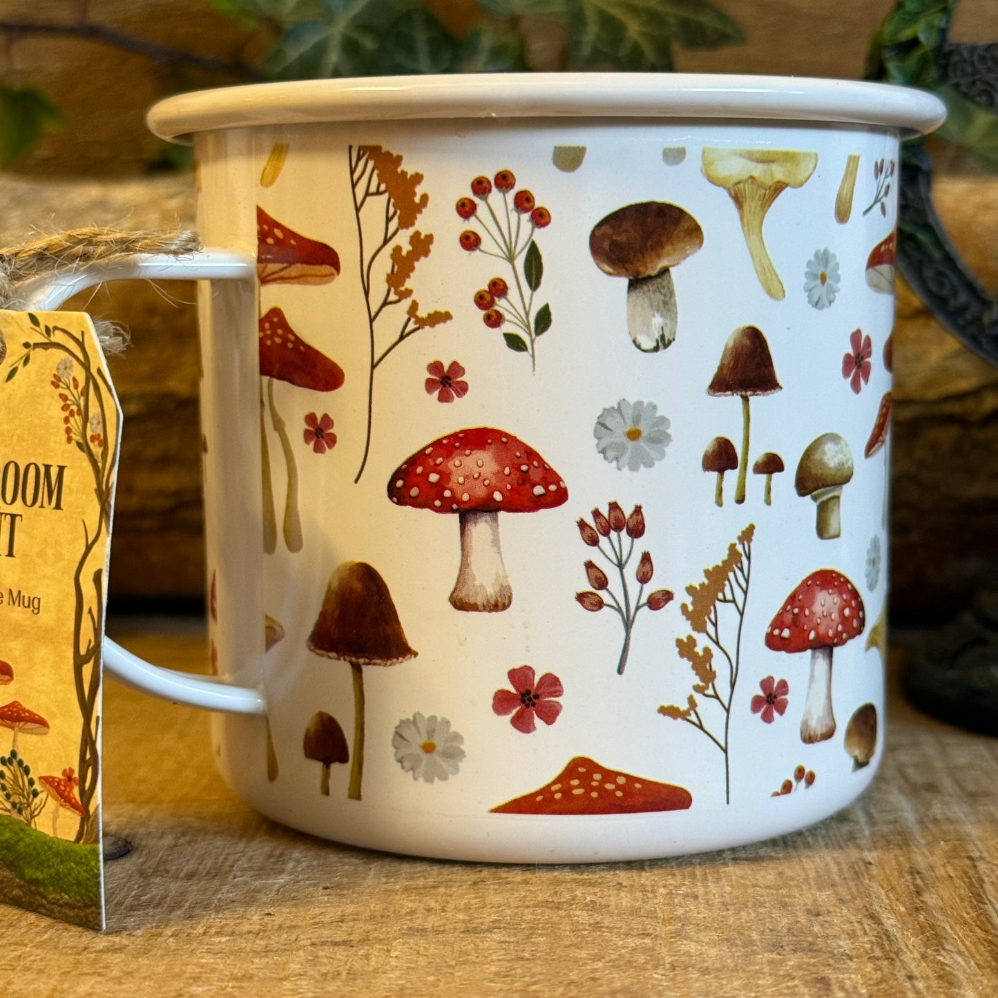 Enjoy tea in the All Over Mushroom Print Enamel Mug. Lightweight toadstool design, 500ml capacity, part of the Enchanted Forest collection.