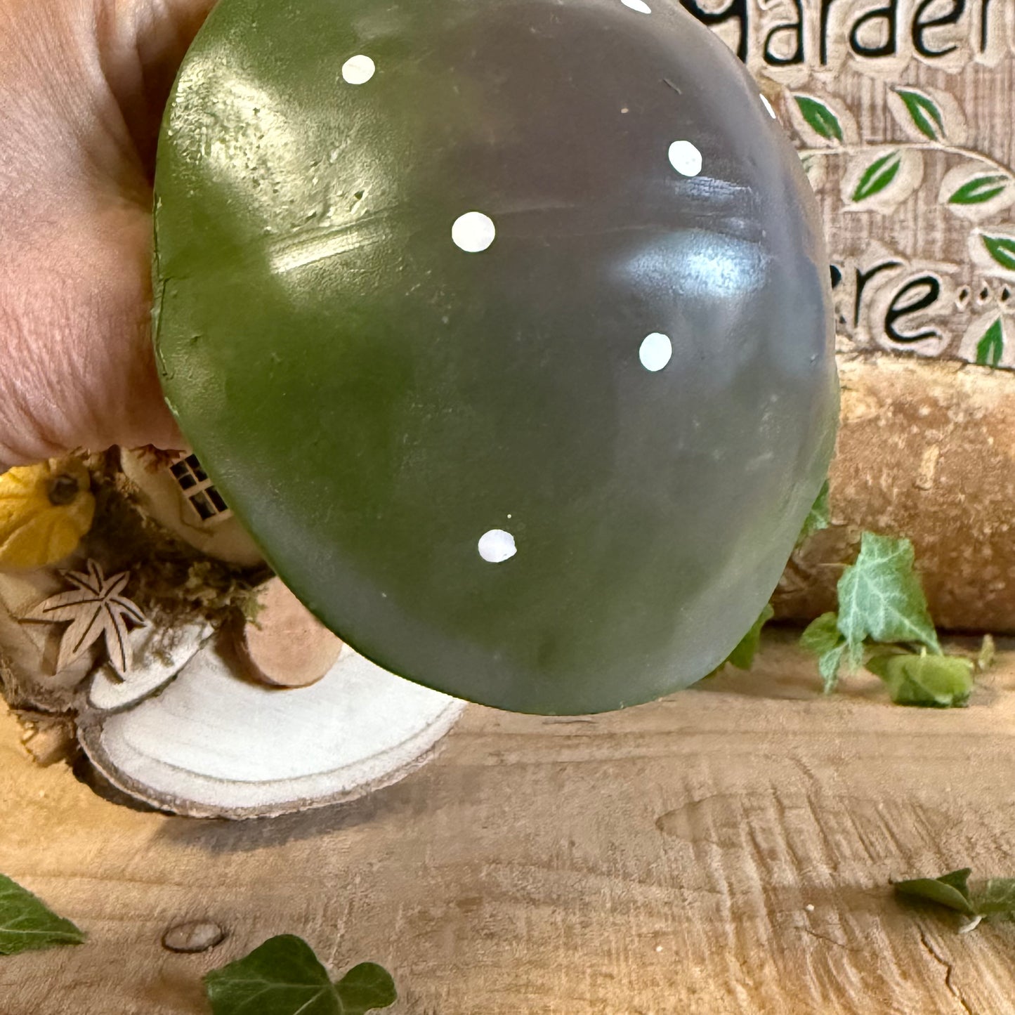 Welcome all who wander with this charming Folk Art Mushroom Cottage with Welcome Sign (Large) — a beautifully hand painted fairy house inspired by woodland folklore and cosy forest living. Its bright toadstool roof, delicate floral detailing, and rustic textures create the feeling of a tiny cottage nestled beneath ancient trees.