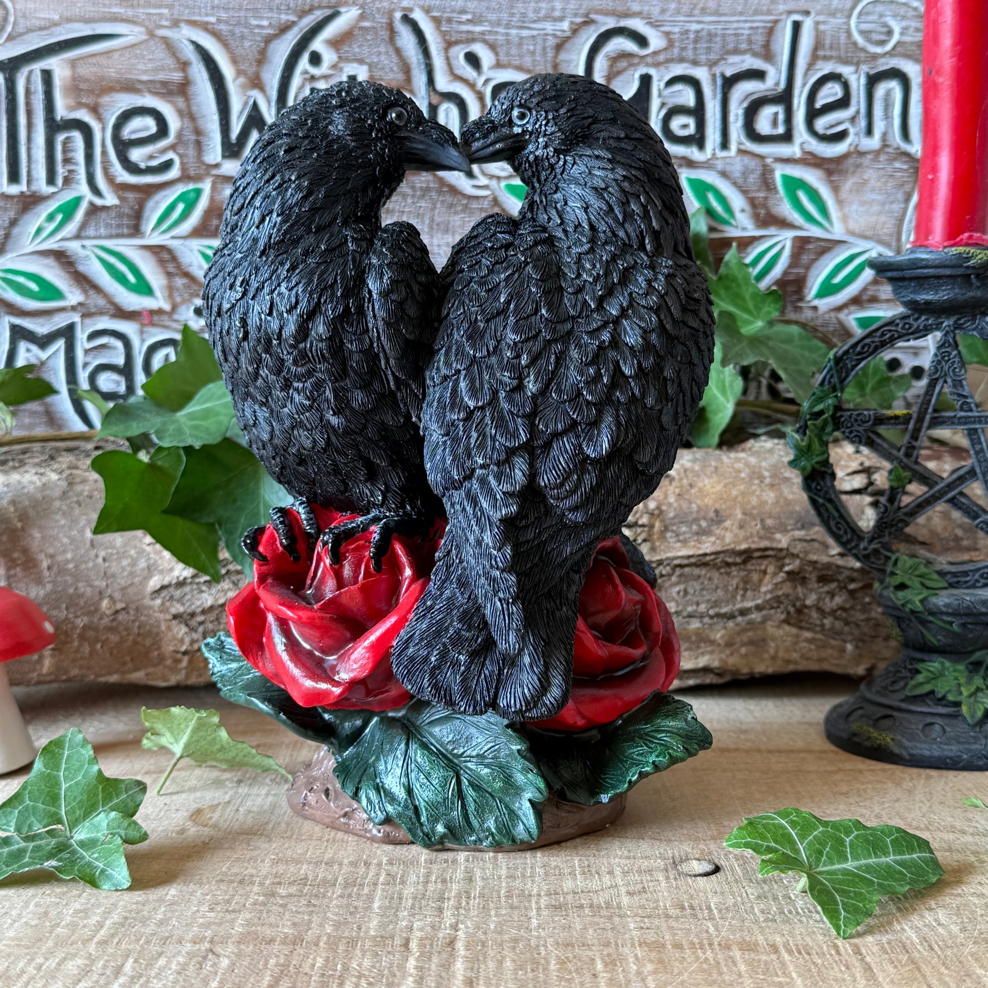 Nemesis Now Raven Romance figurine featuring two black ravens and red roses. Hand-painted gothic resin ornament for collectors, altars and raven lovers.
