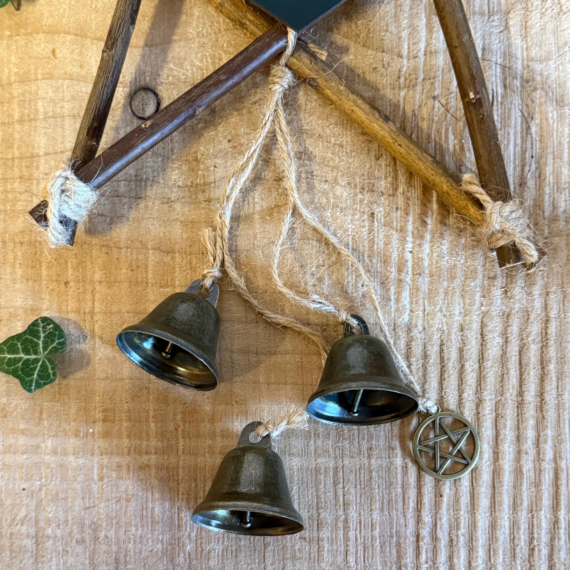 Invite protection and harmony with the Green Witch willow pentagram with bells. Witch bells for cleansing energy, home or garden decor.