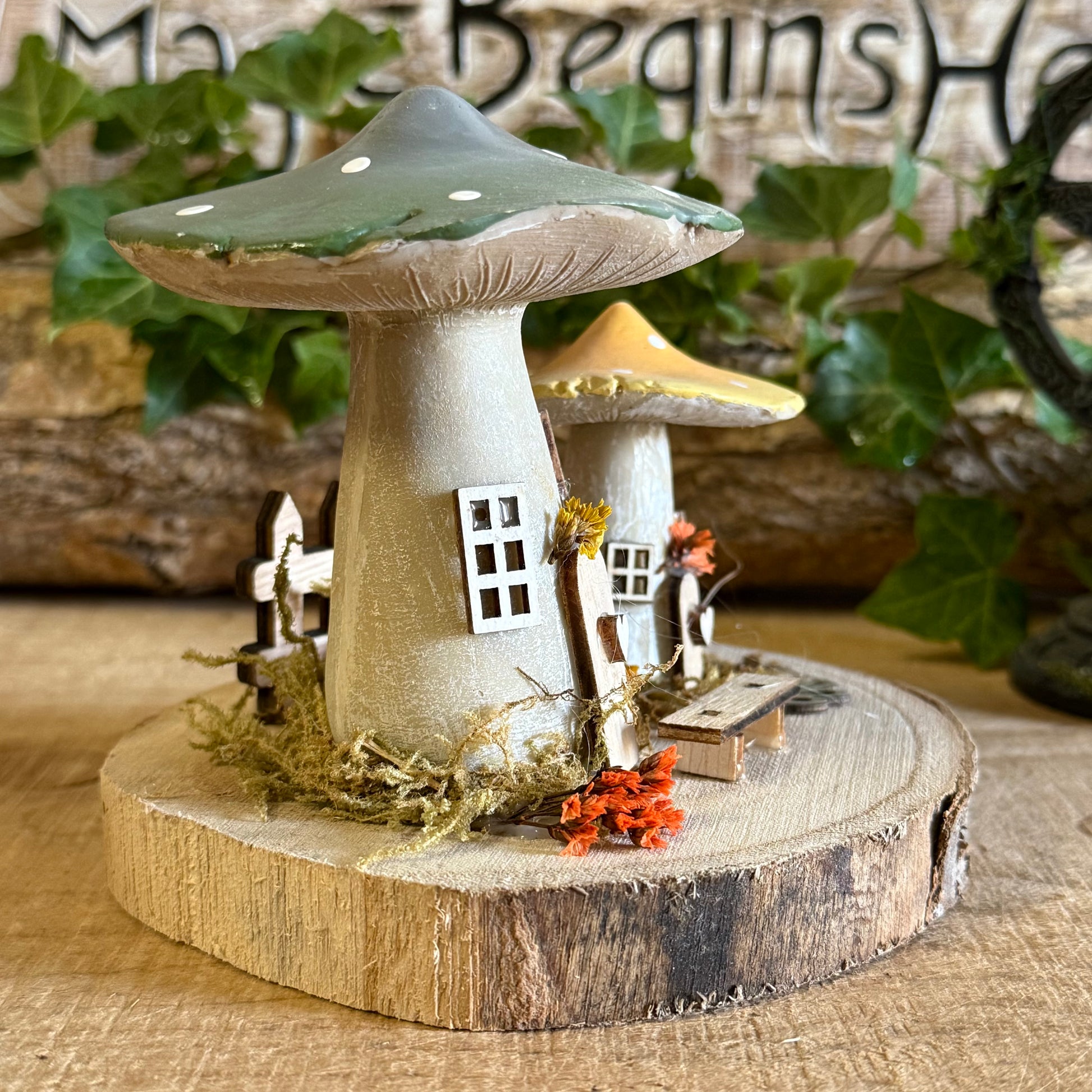 Discover the gentle magic of our Folk Art Mushroom Two Cottages (Medium) — a charming pair of fairy houses brought to life with hand painted folk art detail. Each piece is crafted with care, featuring vibrant colours, floral patterns, and rustic textures that capture the joy and simplicity of woodland living.
