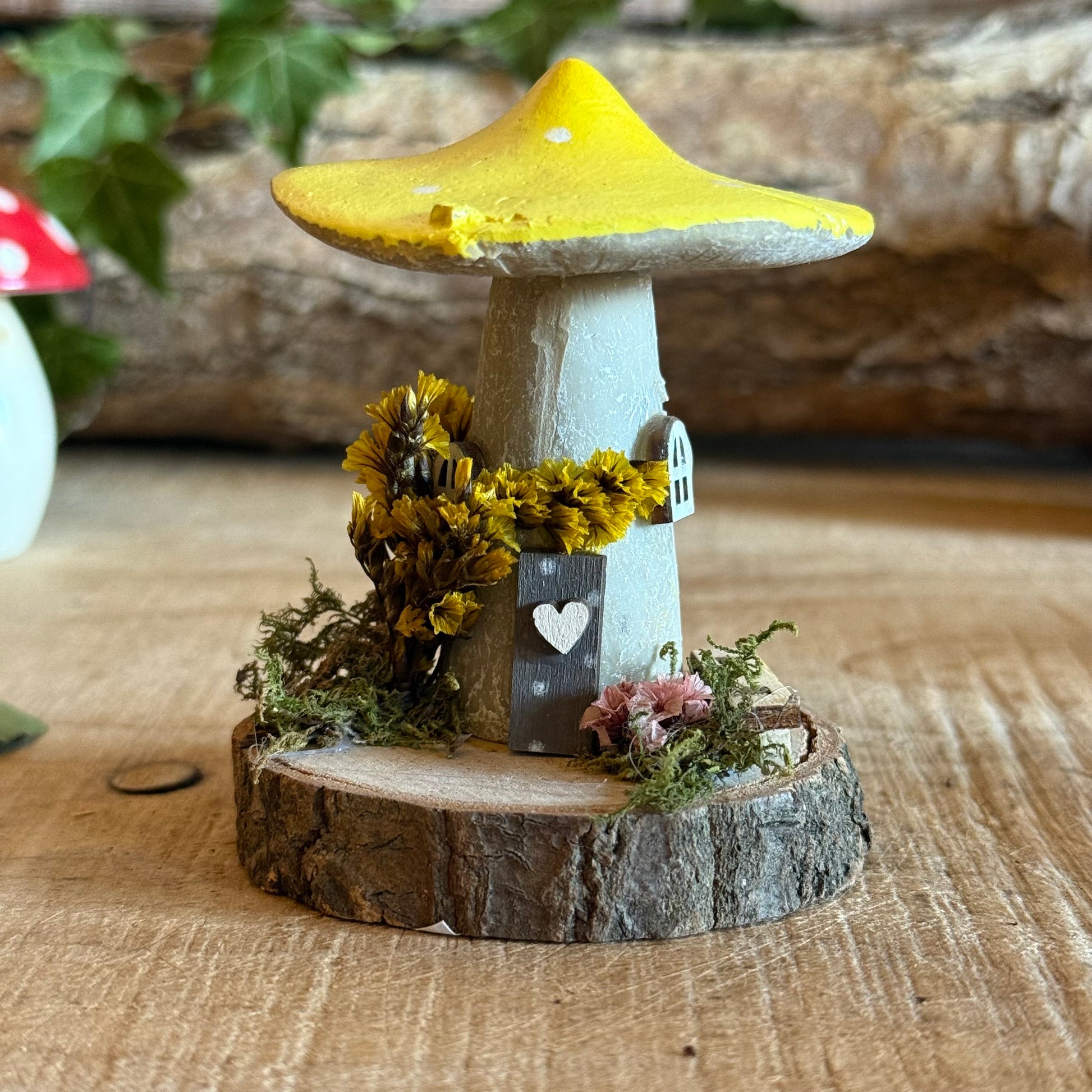 Step into a storybook world with our Spring Folk Art Mushroom Cottage, a charming miniature home inspired by blooming meadows and enchanted forests. Each cottage is hand painted with loving detail, featuring bright spring tones and floral folk art patterns that celebrate renewal and the magic of nature’s awakening.