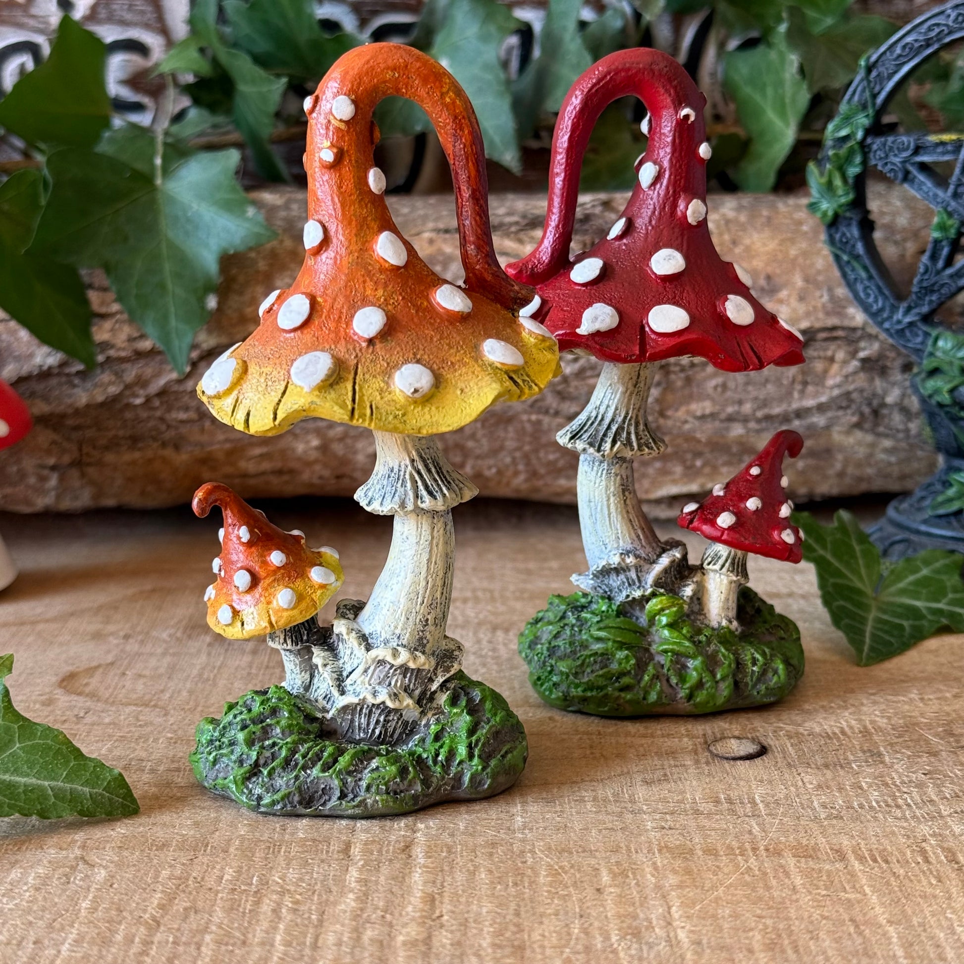 Set of 2 hand-painted mushroom sculptures, 12.5cm tall, with whimsical woodland detailing. Perfect for fairy gardens, fantasy displays and mushroom lovers.