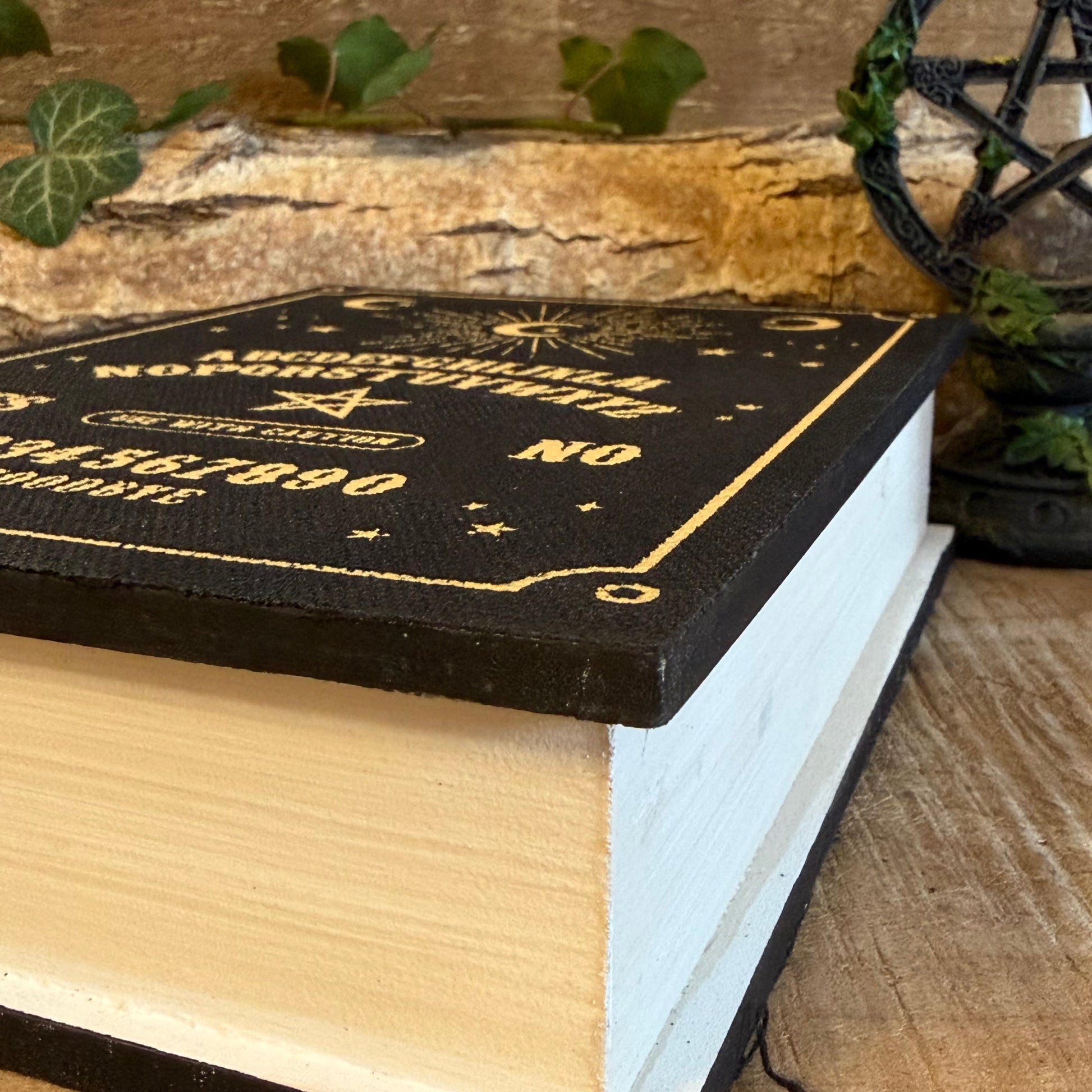 Store keys and jewellery in the Talking Board book shaped storage box. Black and gold mystical design from the Summon the Spirits collection.