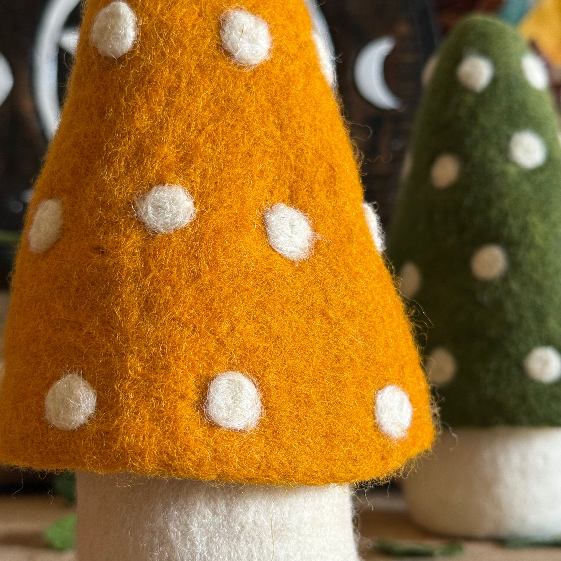 Step into the enchanted world of Buddhamoon, where forest dreams and woodland whimsy come alive. Our Felt Large Standing Mushroom Decoration is a playful delight—perfect for bringing a touch of pixie charm to your home. Decorate your mantle, desk, dresser, or any dry nook that could use a dash of magic and colour.
