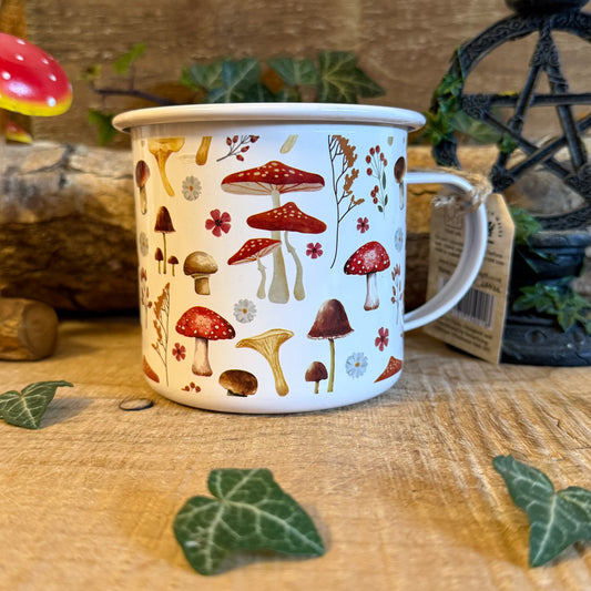 Enjoy tea in the All Over Mushroom Print Enamel Mug. Lightweight toadstool design, 500ml capacity, part of the Enchanted Forest collection.