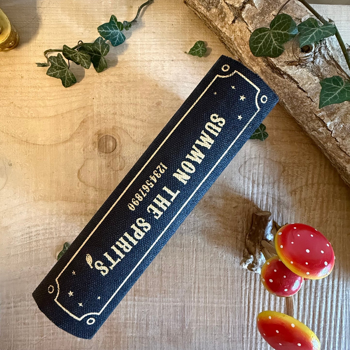 Store keys and jewellery in the Talking Board book shaped storage box. Black and gold mystical design from the Summon the Spirits collection.