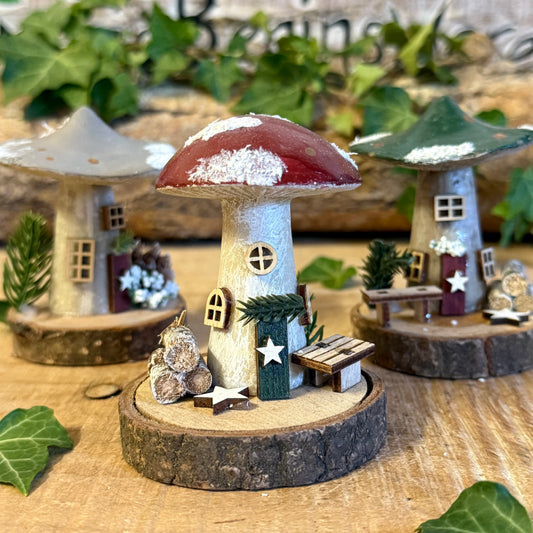 Invite a touch of winter woodland enchantment into your home with our Folk Art Xmas Mushroom Cottage (Small). This charming little cottage is hand painted in festive colours, blending folk art florals with the cosy magic of Yuletide.