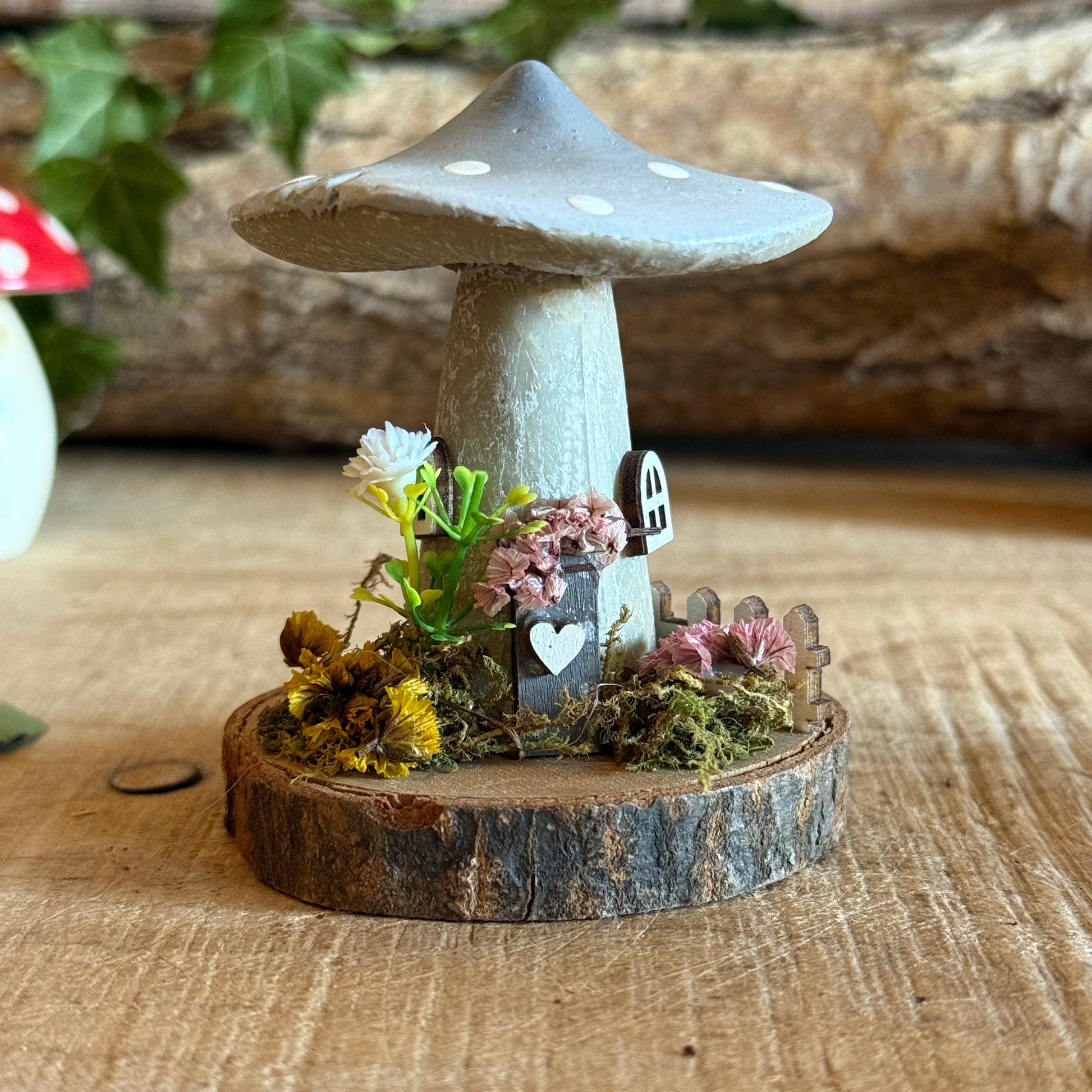 Step into a storybook world with our Spring Folk Art Mushroom Cottage, a charming miniature home inspired by blooming meadows and enchanted forests. Each cottage is hand painted with loving detail, featuring bright spring tones and floral folk art patterns that celebrate renewal and the magic of nature’s awakening.