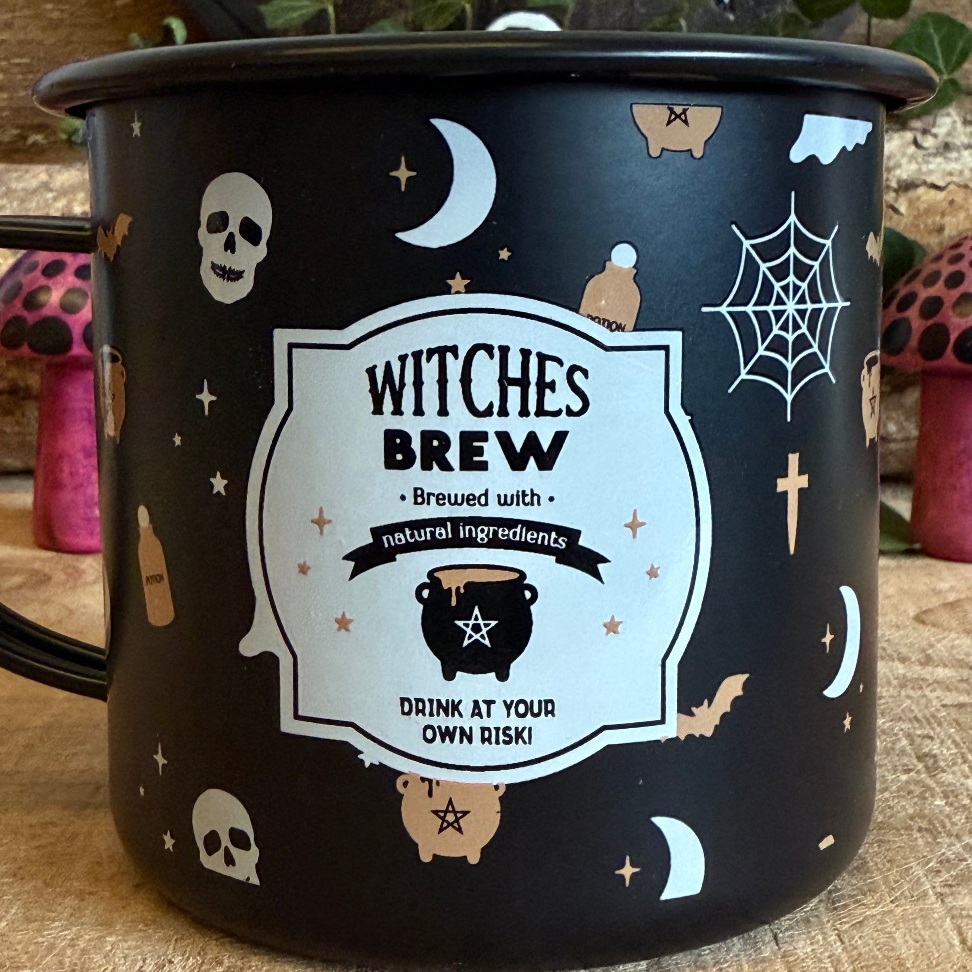 Even witches need to keep hydrated! This enamel-style mug features a fun Halloween print with a vintage-inspired “Witches Brew” illustration, perfect for enjoying a hot pumpkin spice latte or cosy autumn beverage. Part of the Halloween range by Something Different, it pairs beautifully with other spooky gifts and seasonal décor. Designed for hand wash only, do not microwave or use over an open flame. A charming and practical addition to your Halloween celebrations or gift collection.