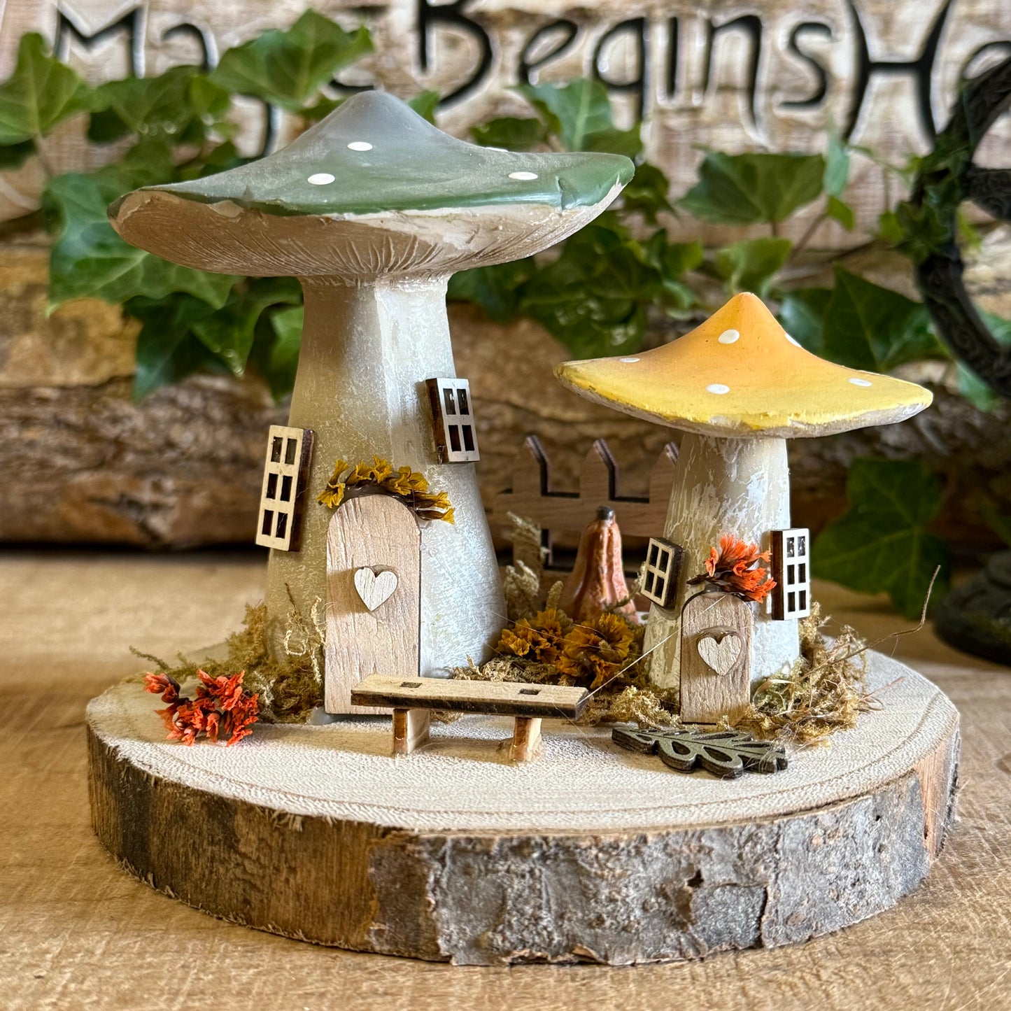 Discover the gentle magic of our Folk Art Mushroom Two Cottages (Medium) — a charming pair of fairy houses brought to life with hand painted folk art detail. Each piece is crafted with care, featuring vibrant colours, floral patterns, and rustic textures that capture the joy and simplicity of woodland living.