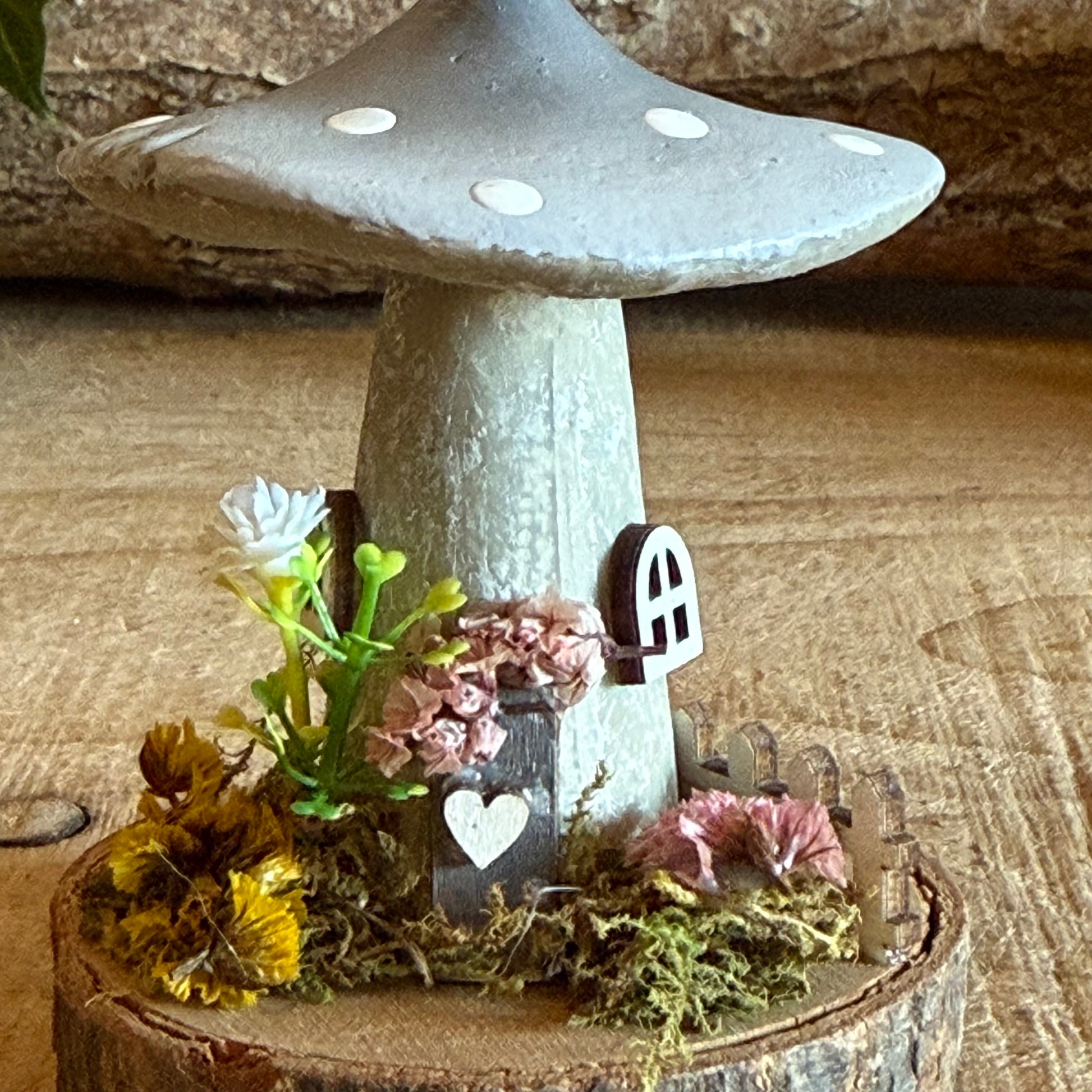 Step into a storybook world with our Spring Folk Art Mushroom Cottage, a charming miniature home inspired by blooming meadows and enchanted forests. Each cottage is hand painted with loving detail, featuring bright spring tones and floral folk art patterns that celebrate renewal and the magic of nature’s awakening.