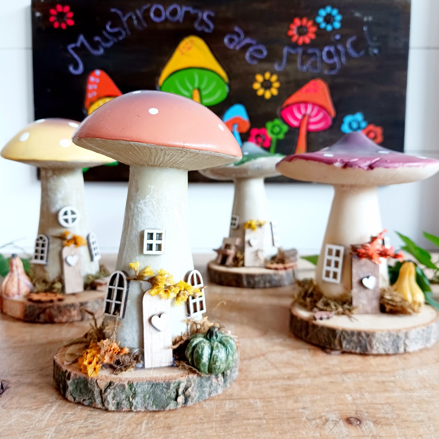 Add a whimsical touch to your home with these charming folk art mushroom cottages. Perfect for all occasions, these handcrafted ornaments are made from high-quality polystone and wood, featuring delightful details and a rustic base made from natural wood slices. Whether placed on a shelf, desk, or windowsill, these miniature cottages bring warmth and personality to any space. Ideal for gifting or as a unique addition to your home décor collection.