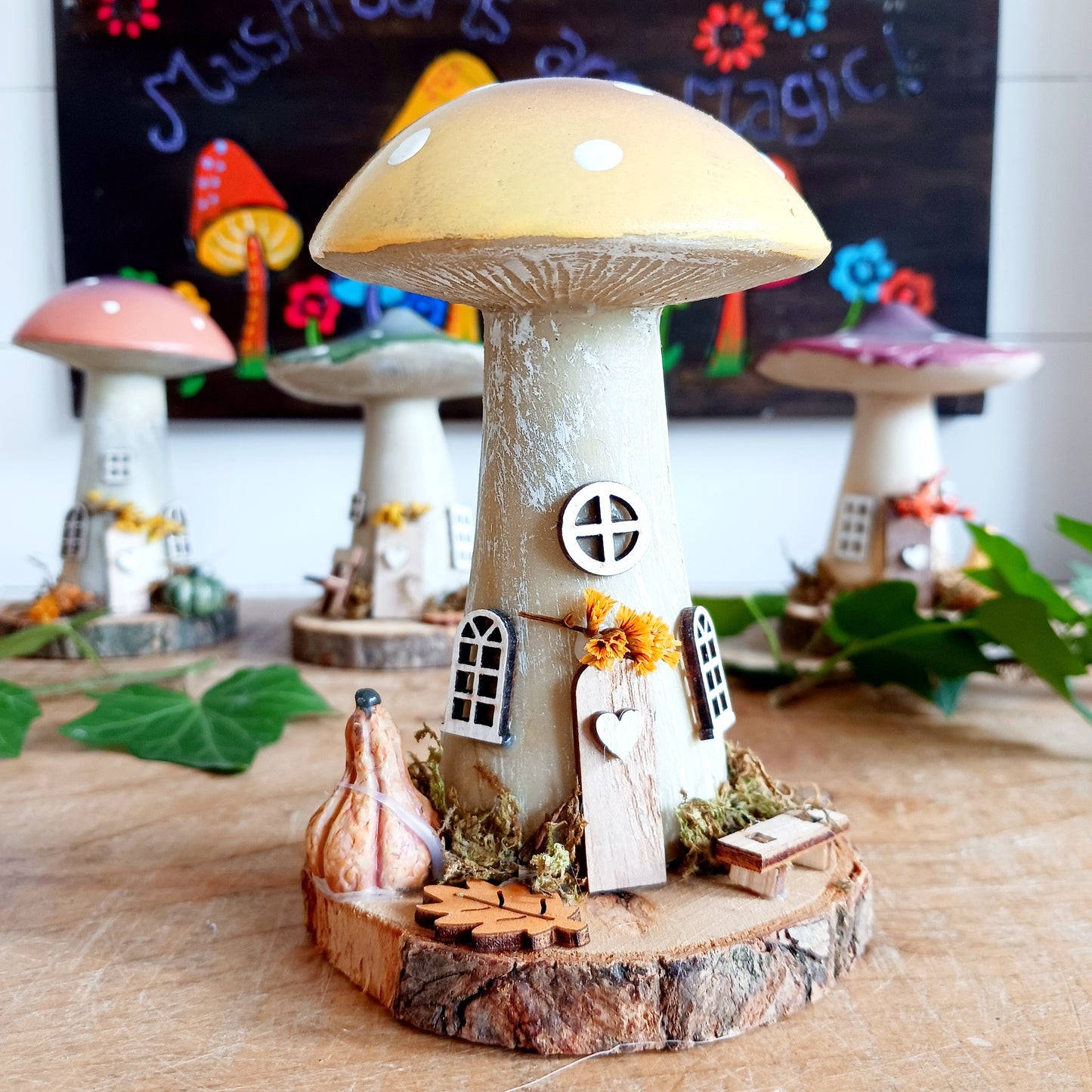 Add a whimsical touch to your home with these charming folk art mushroom cottages. Perfect for all occasions, these handcrafted ornaments are made from high-quality polystone and wood, featuring delightful details and a rustic base made from natural wood slices. Whether placed on a shelf, desk, or windowsill, these miniature cottages bring warmth and personality to any space. Ideal for gifting or as a unique addition to your home décor collection.