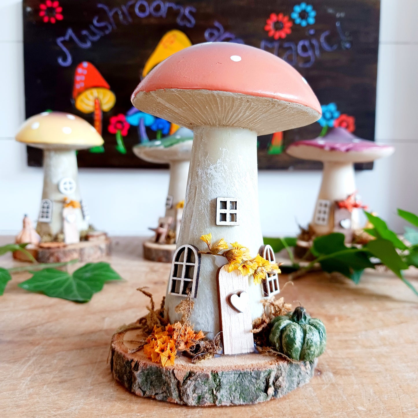 Add a whimsical touch to your home with these charming folk art mushroom cottages. Perfect for all occasions, these handcrafted ornaments are made from high-quality polystone and wood, featuring delightful details and a rustic base made from natural wood slices. Whether placed on a shelf, desk, or windowsill, these miniature cottages bring warmth and personality to any space. Ideal for gifting or as a unique addition to your home décor collection.