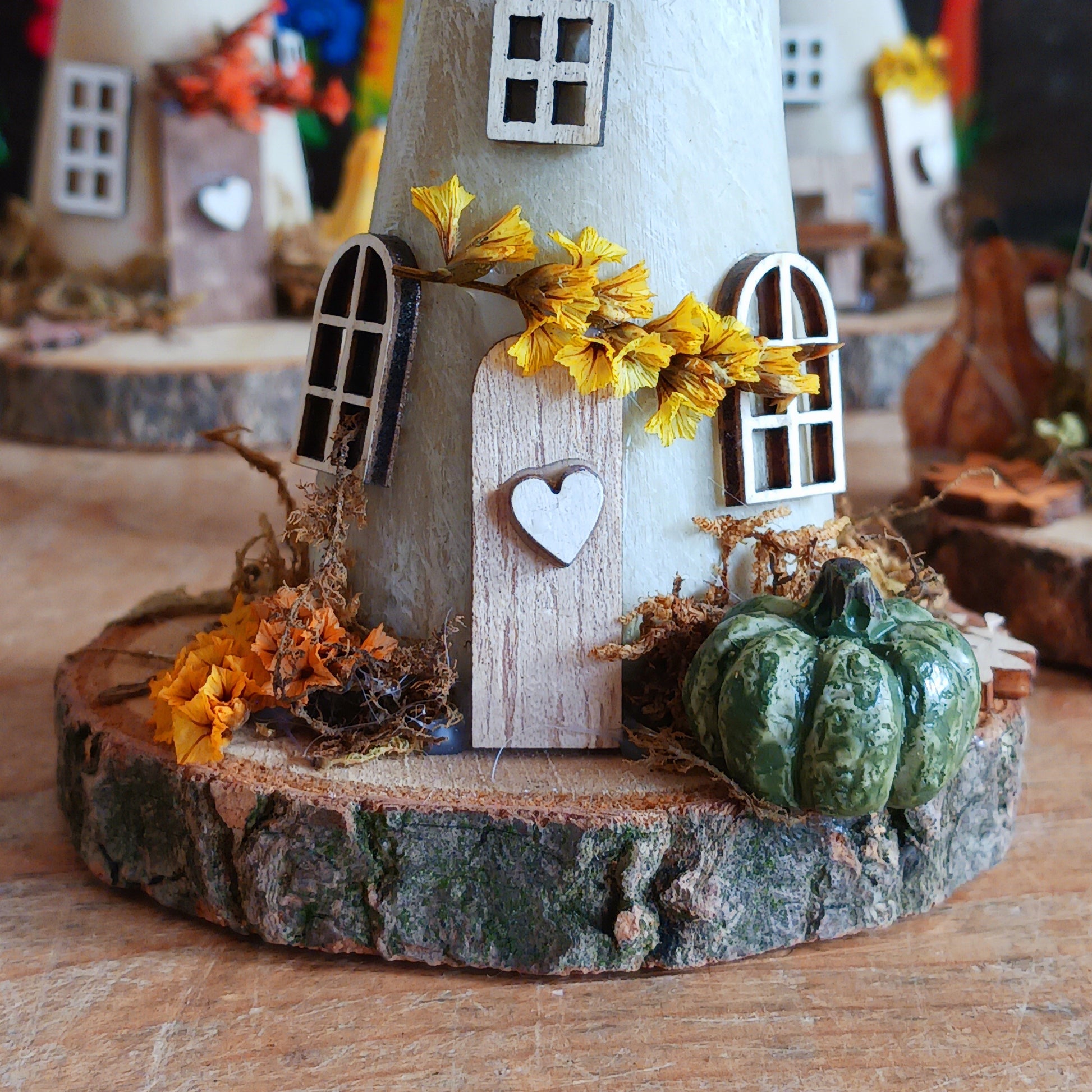 Add a whimsical touch to your home with these charming folk art mushroom cottages. Perfect for all occasions, these handcrafted ornaments are made from high-quality polystone and wood, featuring delightful details and a rustic base made from natural wood slices. Whether placed on a shelf, desk, or windowsill, these miniature cottages bring warmth and personality to any space. Ideal for gifting or as a unique addition to your home décor collection.