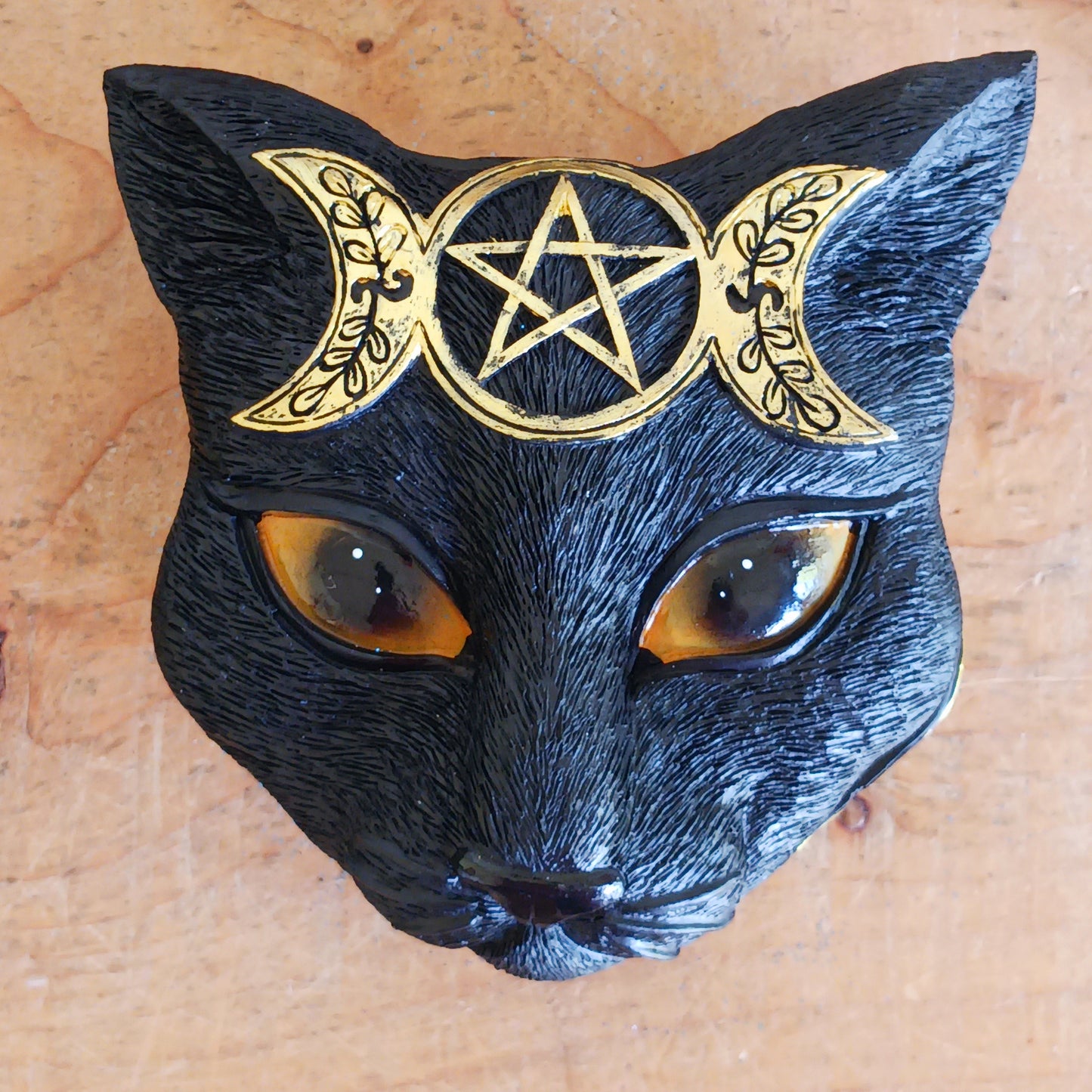 This enchanting Black Cat Triple Moon Trinket Box is the perfect blend of mystery and elegance. Featuring a striking black cat face with piercing eyes on the lid, it’s adorned with intricate, hand-painted gold triple moon designs. 