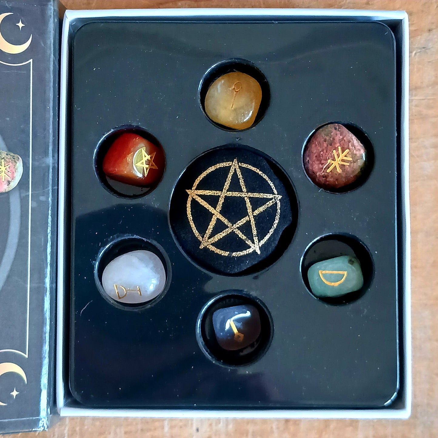 Unlock your inner magic with the Witches Guide to Crystals Gift Set, a beautifully curated kit for crystal divination and manifestation. This enchanting set includes six unique tumble stones—each with its own mystical meaning and purpose—alongside a casting chart to guide your spiritual practice.