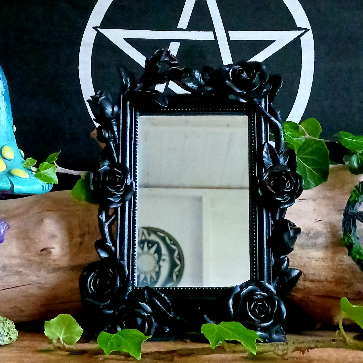 Add a touch of dark romance to your interior with the Rose & Vine Decorative Mirror from the Shades of Alchemy collection. Featuring intricately entwined roses and vines, this striking mirror blends gothic elegance with timeless design.